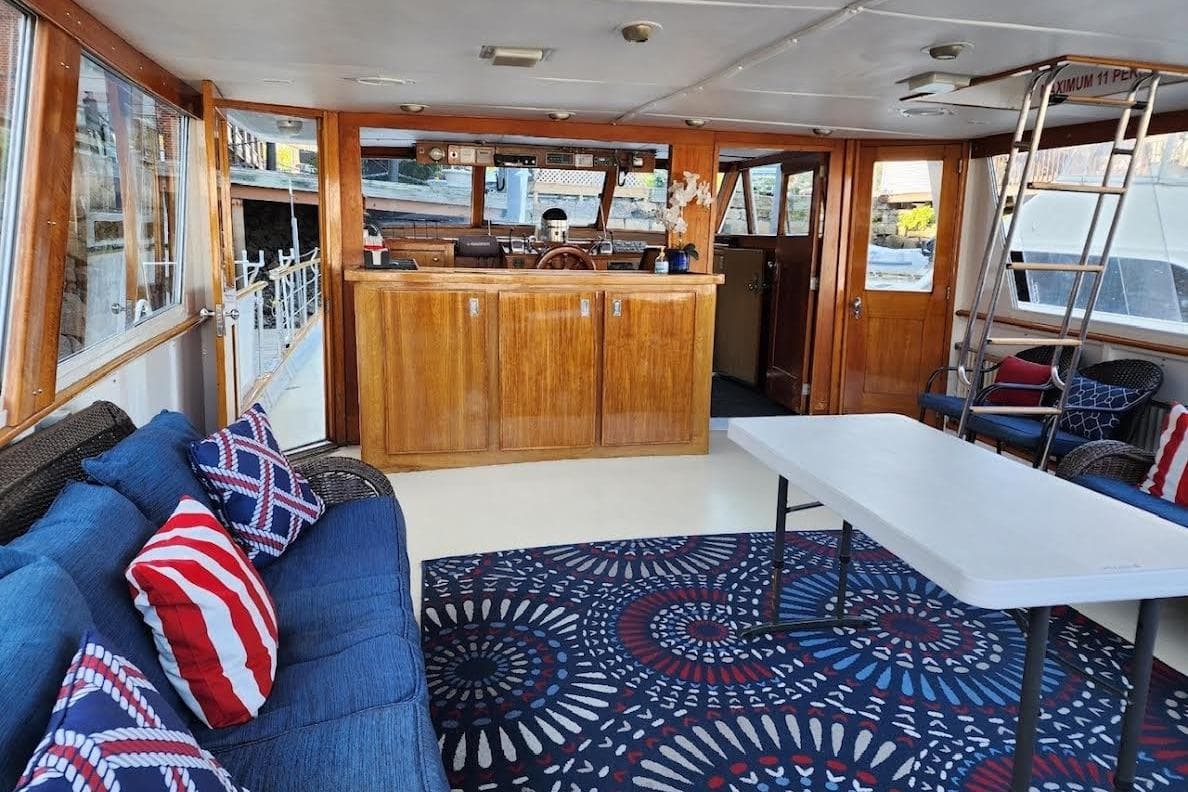 Interior of a 1968 Burger Motor Yacht with cozy seating and nautical decor.