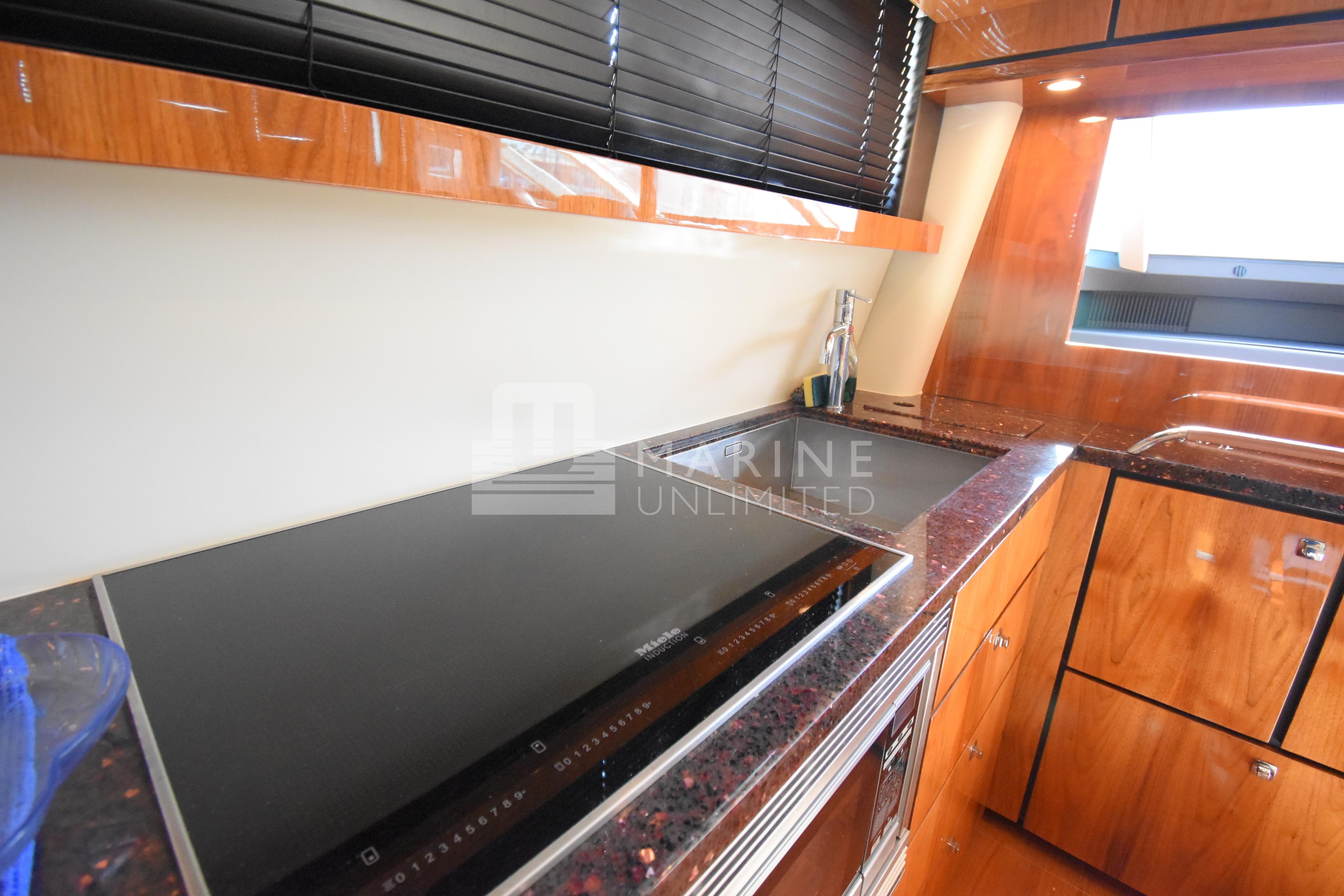 2010 Fairline Squadron 55 yacht kitchen with sleek countertops and modern appliances.