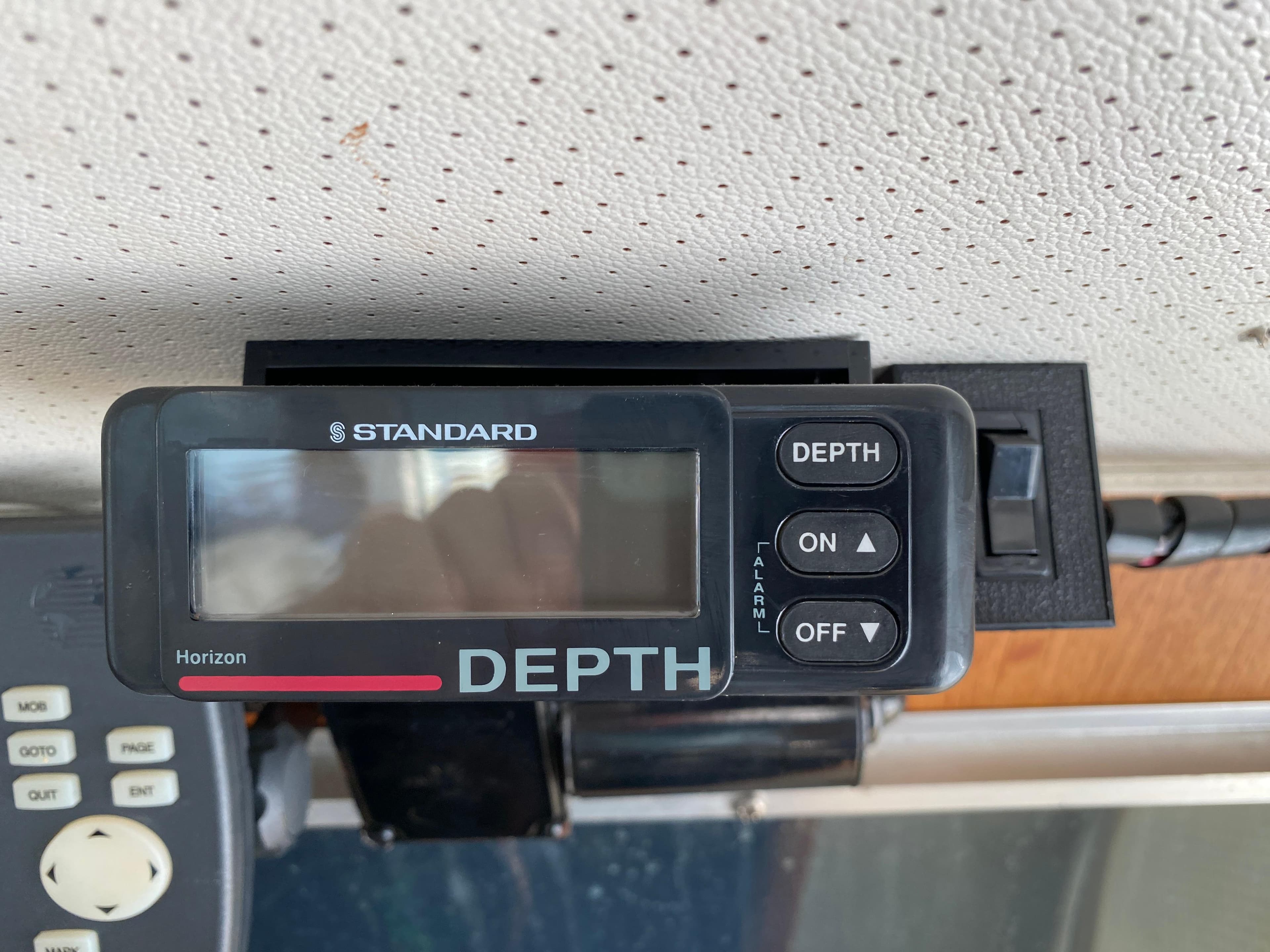 Depth gauge on 1984 Tollycraft 34 Convertible Sedan boat dashboard.