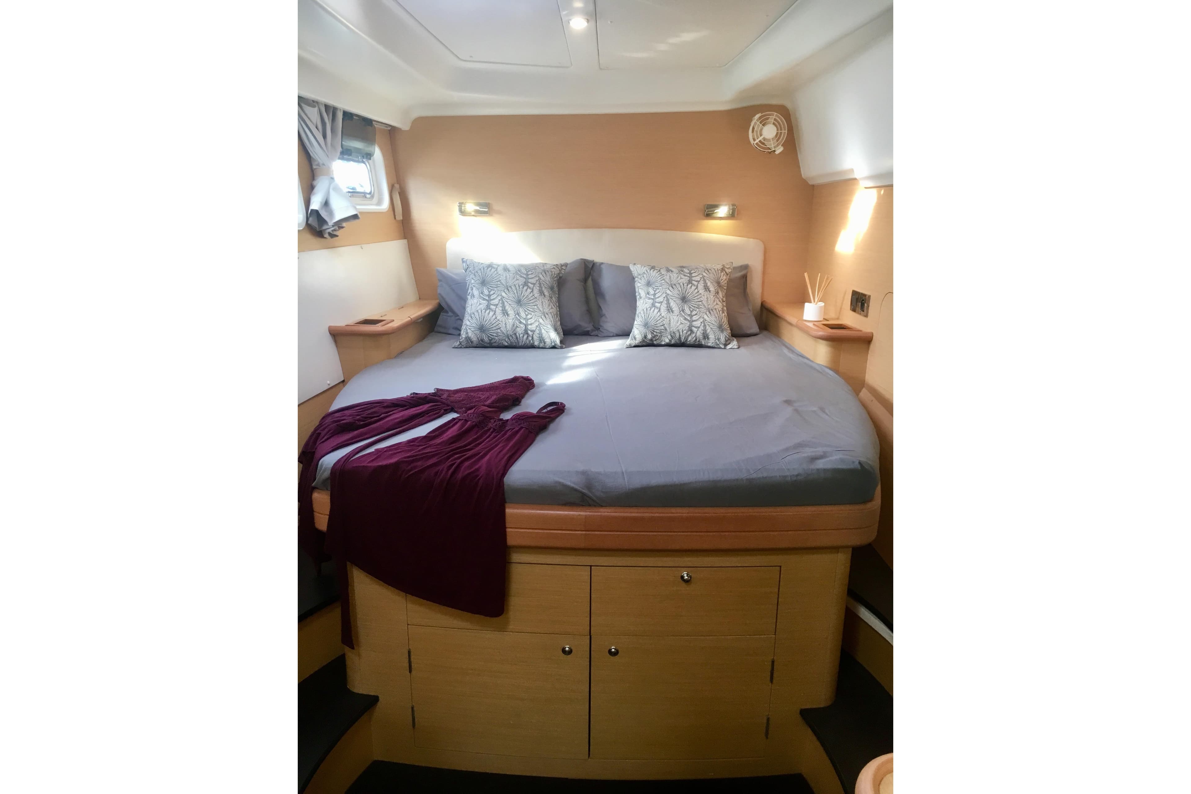 Luxurious cabin interior of 2007 Lagoon 440 catamaran with cozy bed and elegant decor.