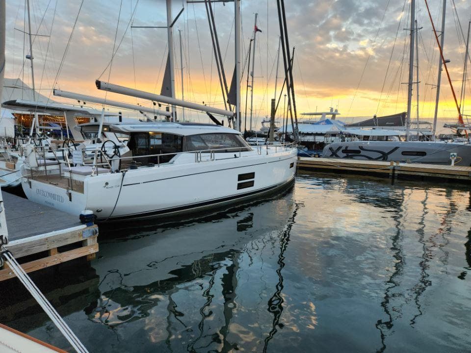 Sailing yacht Moody 41 DS 2025 docked at sunset in a marina.