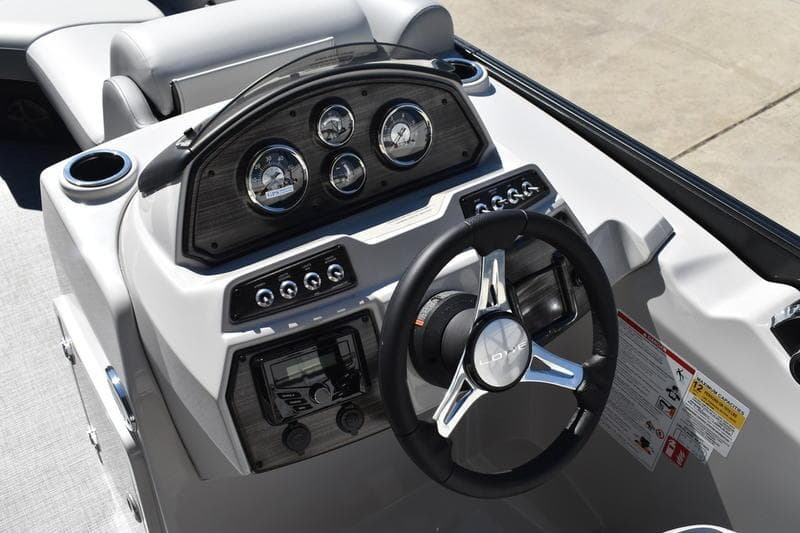 2026 Lowe SS 230 boat dashboard with steering wheel and instrument panel.