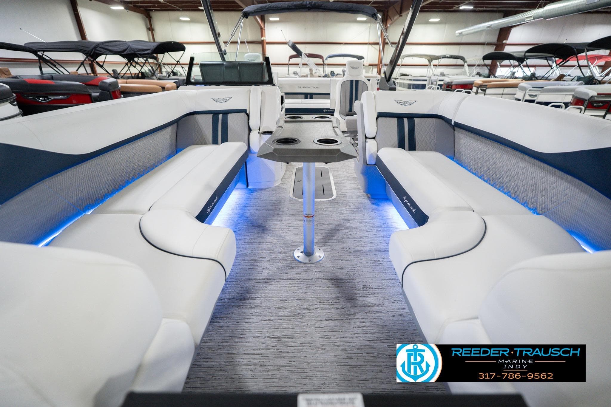 2026 Bennington 24 MCSB boat interior with luxurious seating and ambient lighting.