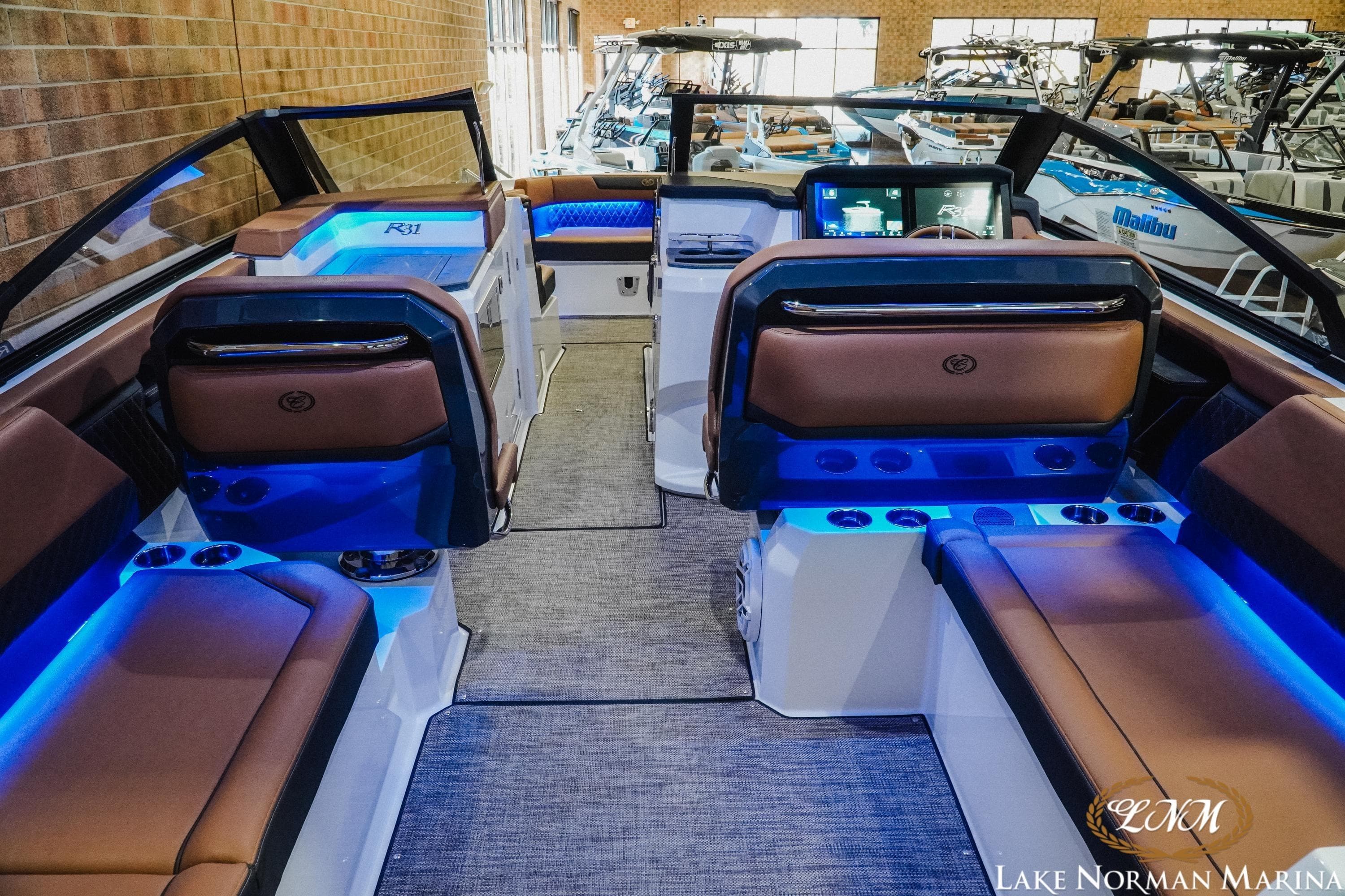 2026 Cobalt R31 boat interior with blue LED lighting and luxurious seating at Lake Norman Marina.