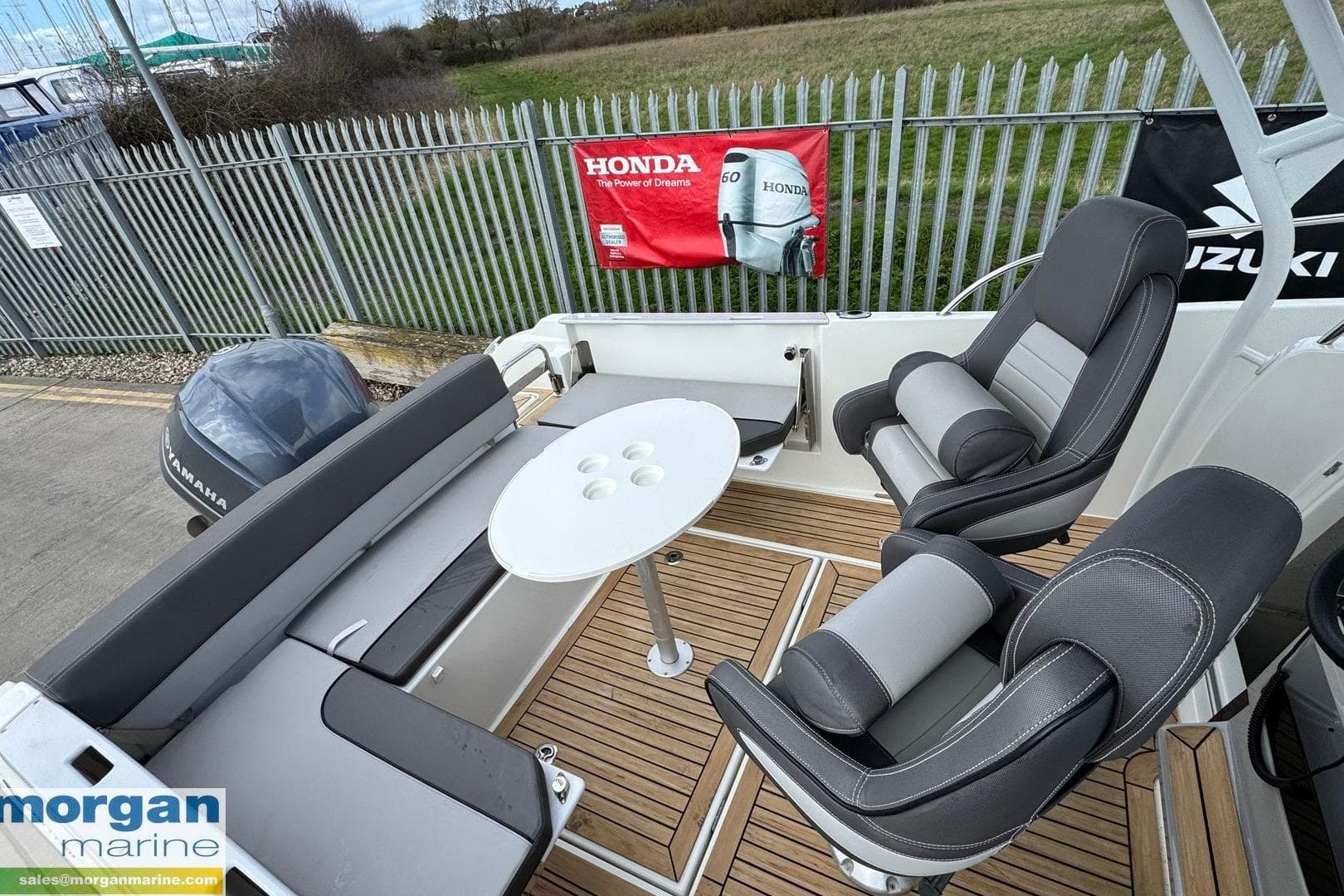 2019 Jeanneau Cap Camarat 7.5 CC Serie 2 boat interior with seating and table.