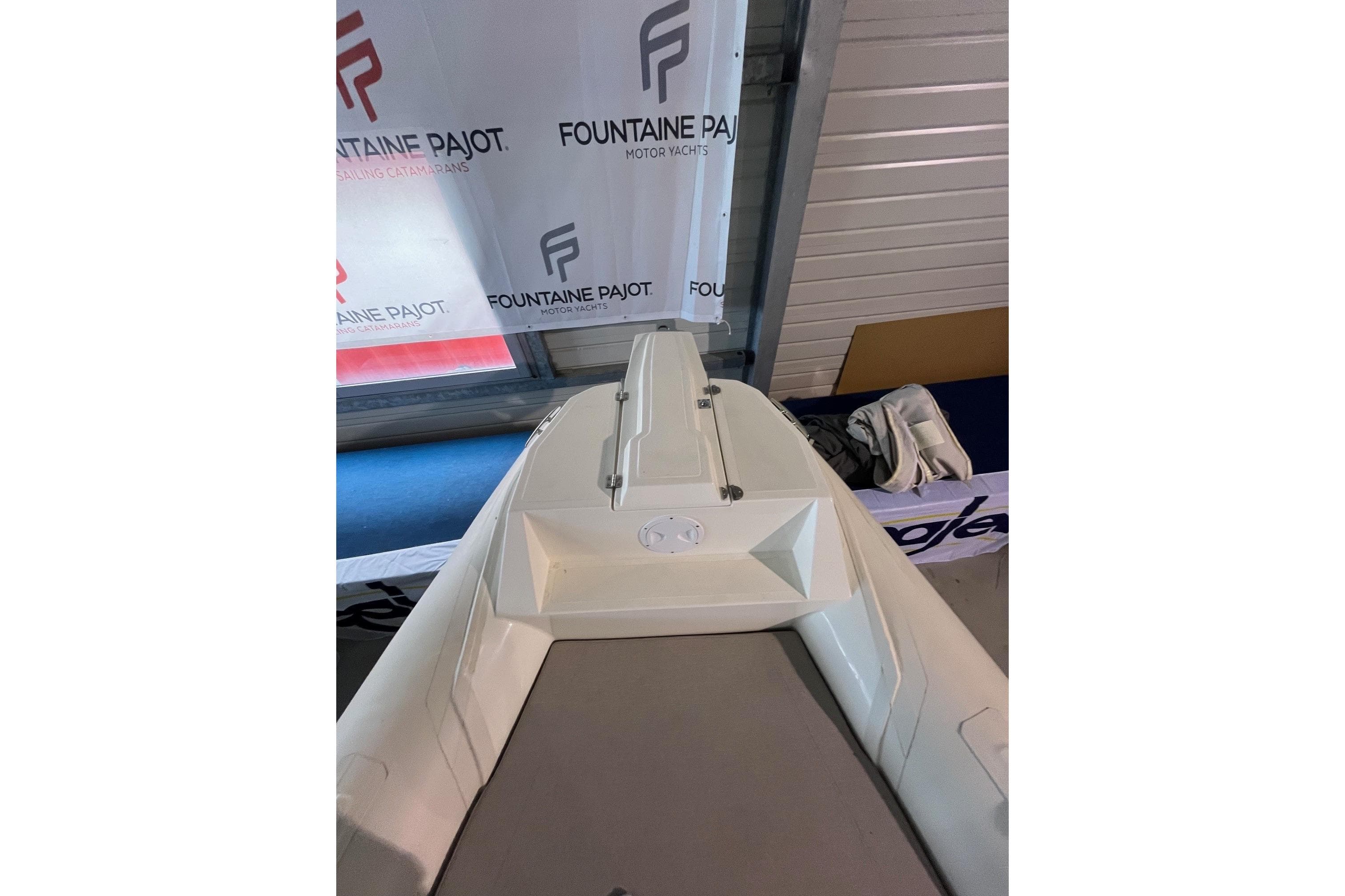 2023 Nuova Jolly 700 XL boat displayed indoors, with Fountaine Pajot branding.