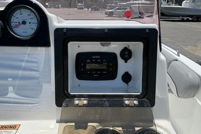 2021 NauticStar 211 Hybrid dashboard with speedometer and control panel.