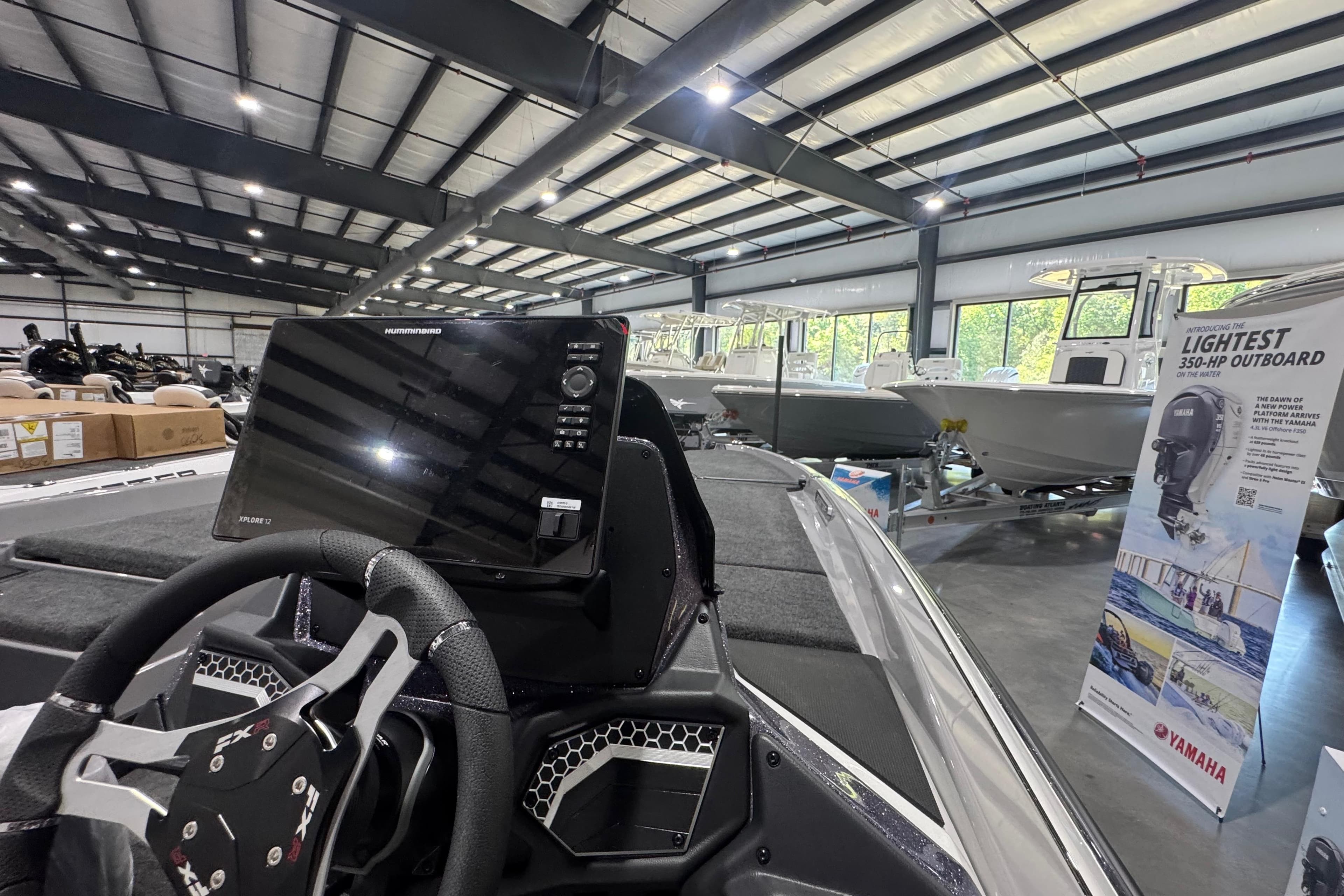 2026 Skeeter FXR21 FLEX boat interior with steering wheel and Humminbird electronics display.