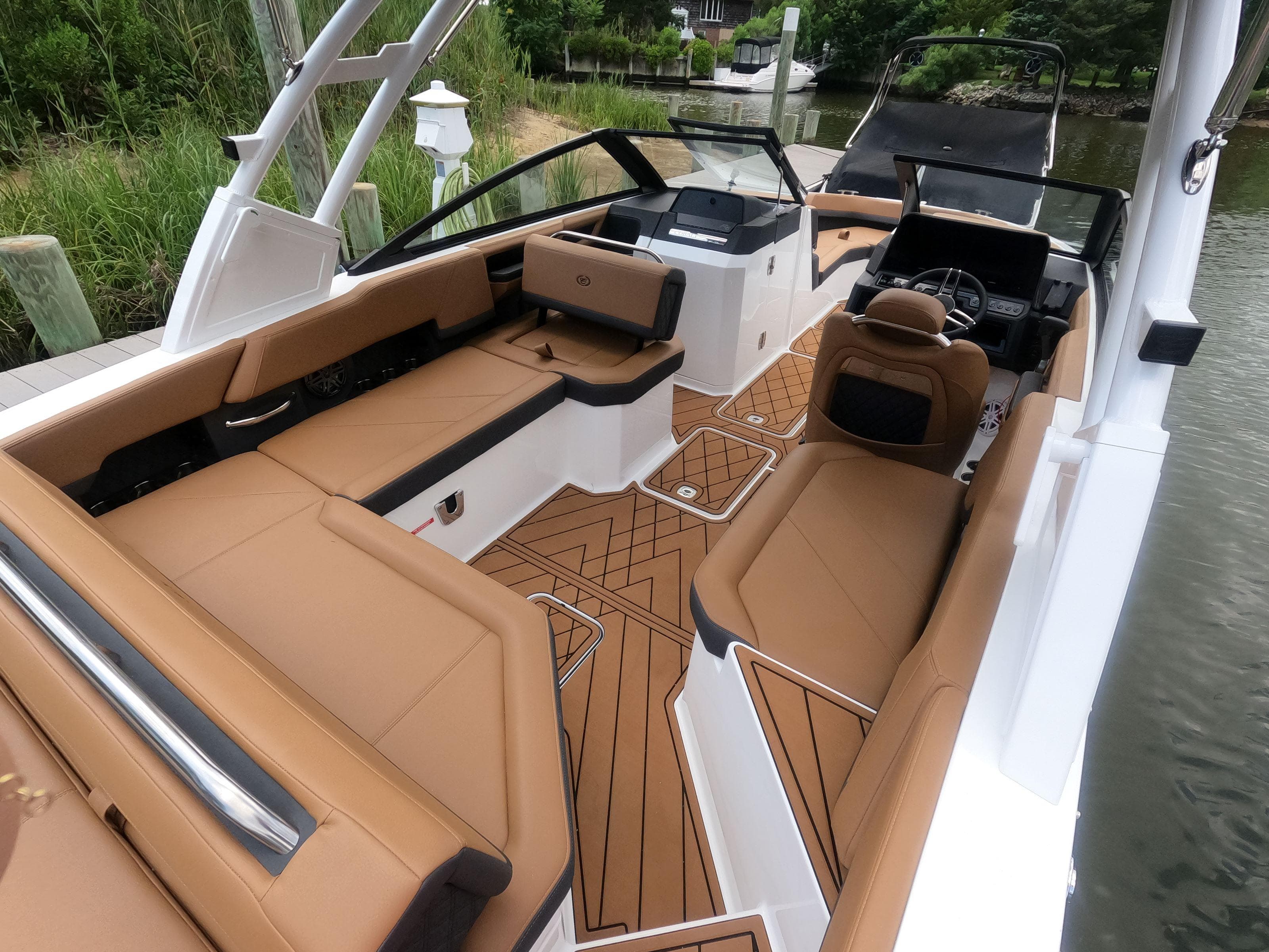 2026 Cobalt R6 boat interior with tan seating and modern design.