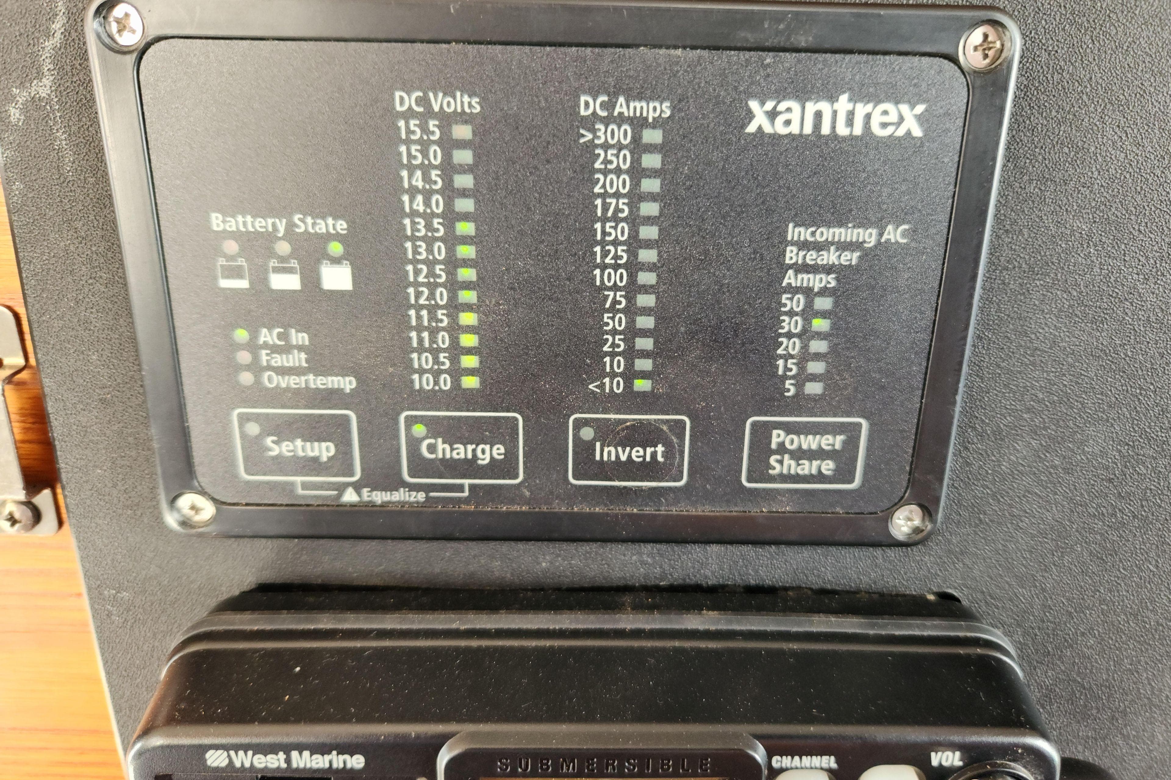 Control panel of a 1983 Grand Banks 36 Classic boat, displaying battery and power settings.