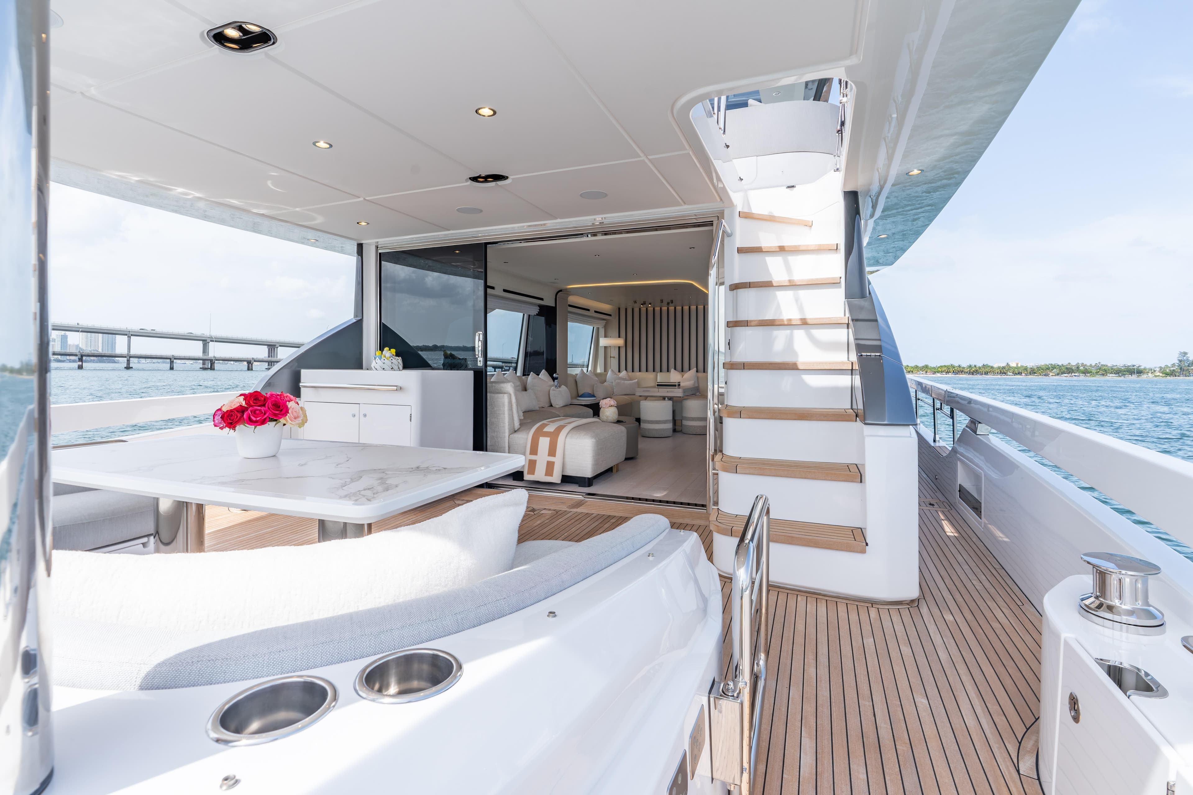 Luxurious 2022 Azimut 78 yacht interior with elegant seating and ocean view.