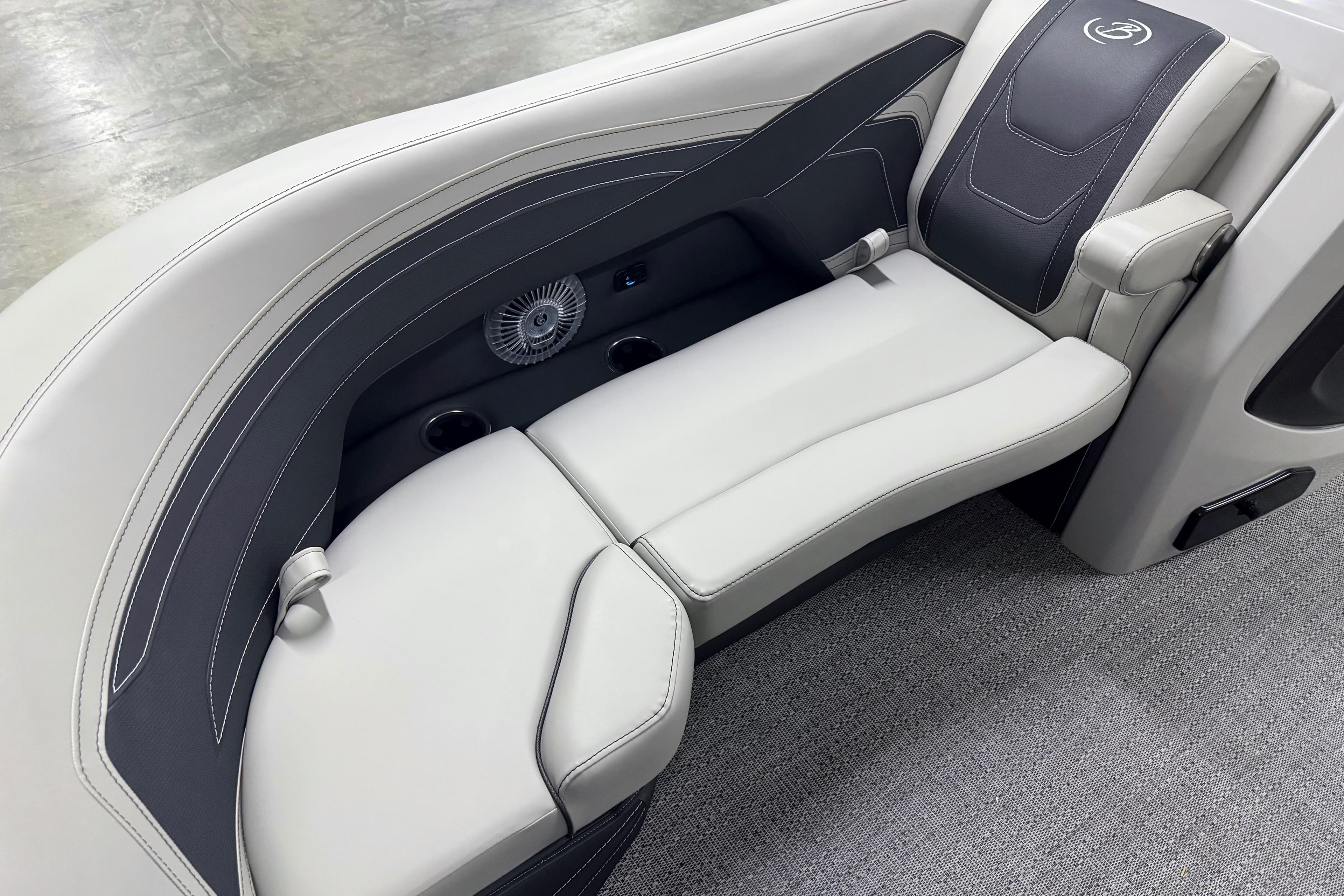 Luxurious seating in the 2026 Barletta Cabrio 24UE pontoon boat, featuring elegant design and comfort.