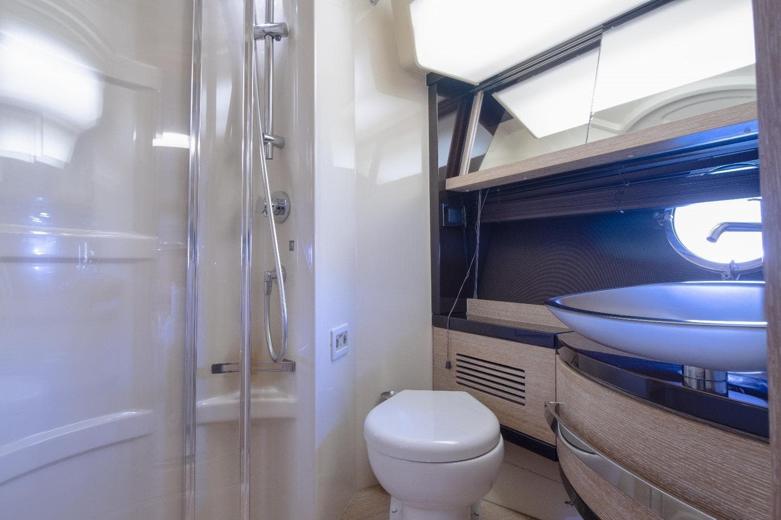 Luxurious bathroom in 2013 Azimut 64 yacht with modern fixtures and elegant design.