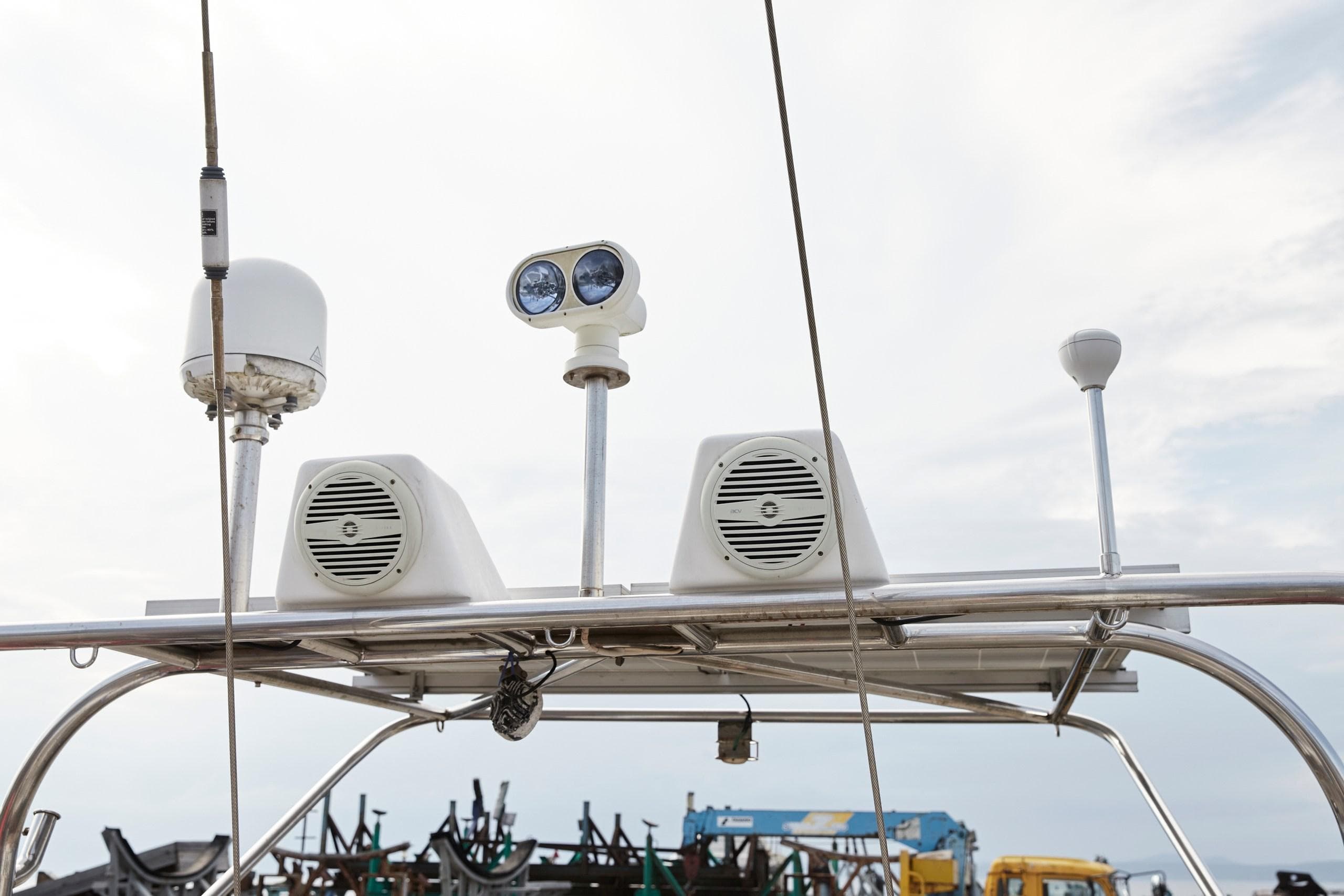 Radar and communication equipment on a 2008 Tayana 58 yacht, featuring antennas and speakers.