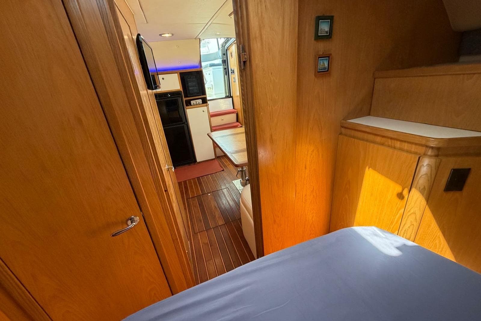 1999 Tiara Yachts 4100 Open interior with wood finish and modern amenities.
