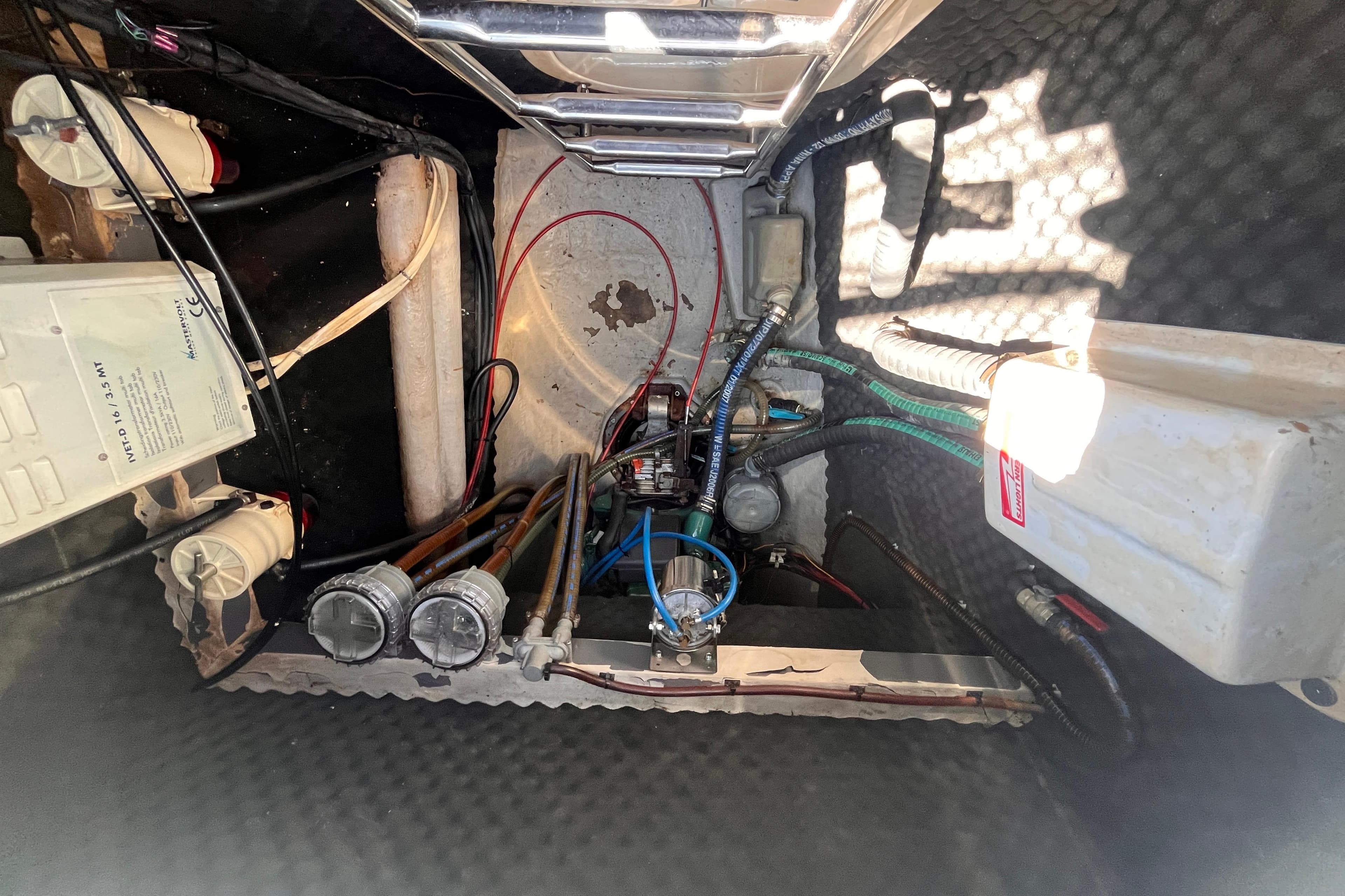 Engine compartment of a 2008 Broadblue 415 catamaran, showcasing wiring and mechanical components.