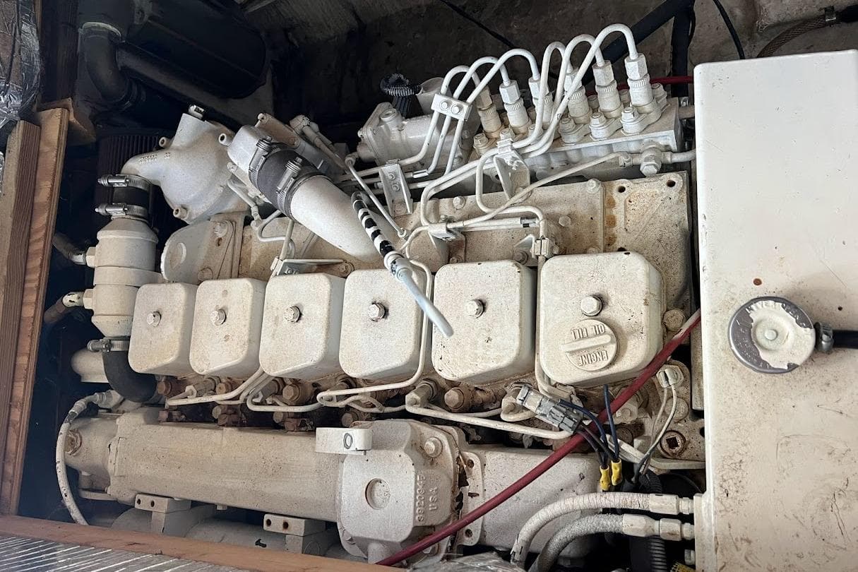 Engine of a 1963 Hatteras 34 Convertible boat, showcasing intricate mechanical components.