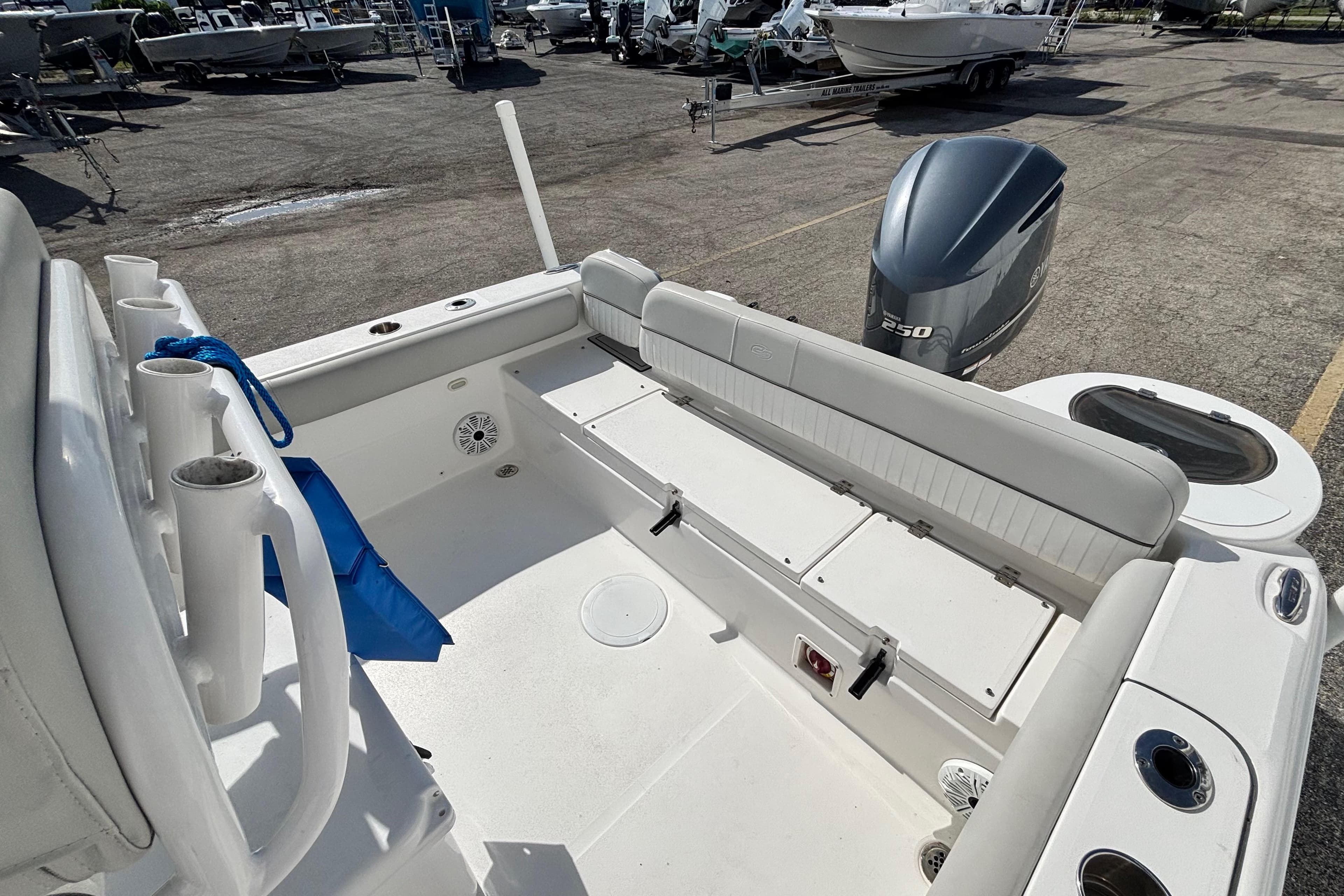 2021 Sea Fox 249 Avenger boat interior with seating and outboard motor.