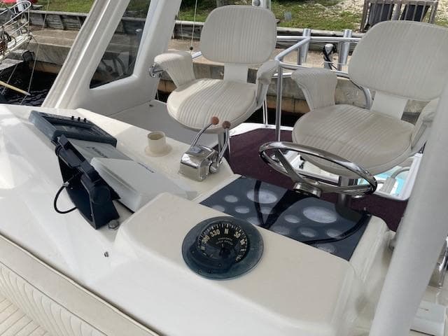 1998 Ocean Yachts 45 Super Sport helm with dual captain chairs and navigation instruments.