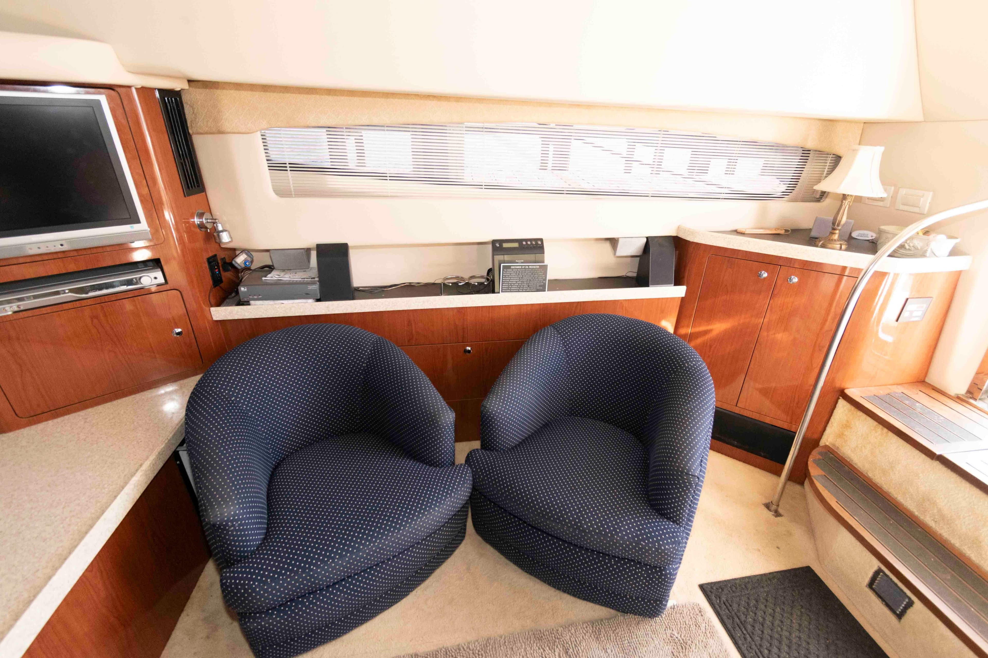 Interior of 2005 Regal Commodore 3880 yacht with cozy seating and entertainment area.