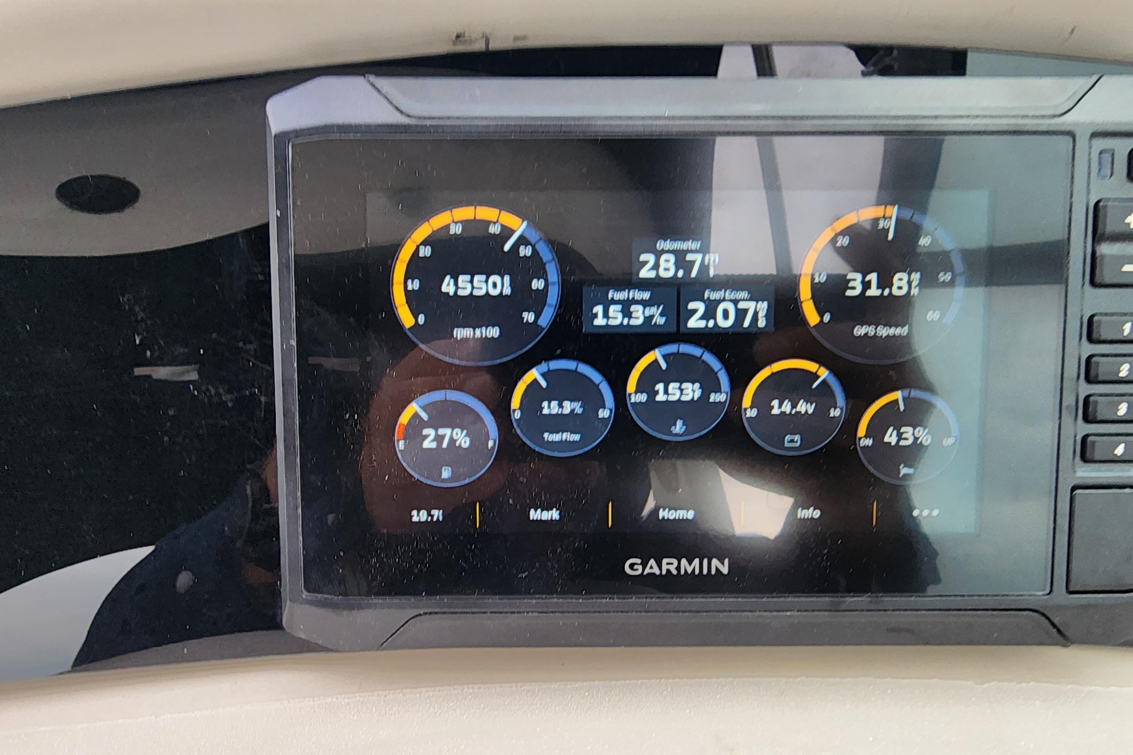 Garmin display on 2003 Sea Ray Sundancer 260 showing RPM, speed, and fuel data.