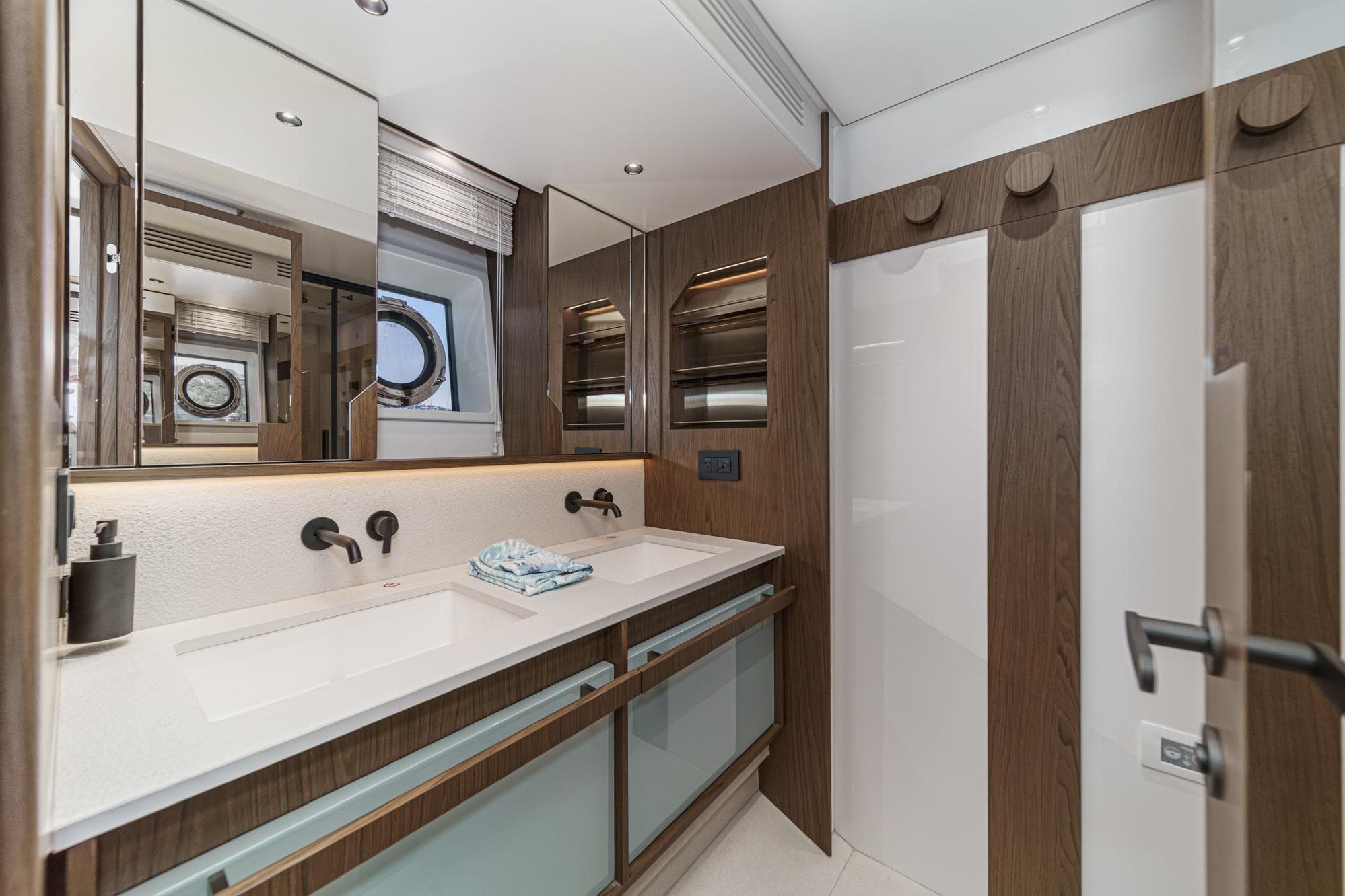 Luxurious bathroom interior of 2026 Azimut Fly 72 yacht with modern fixtures.