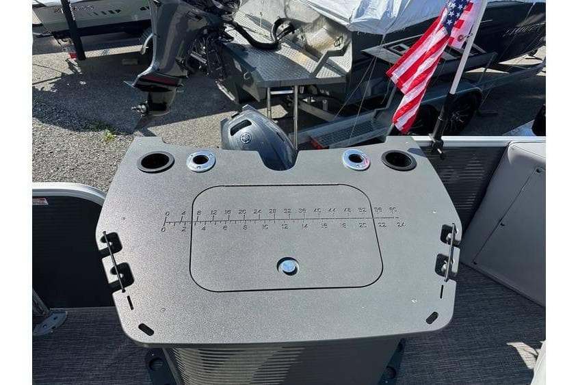 2025 Bennington 20 SF Family boat with fishing seat and American flag.