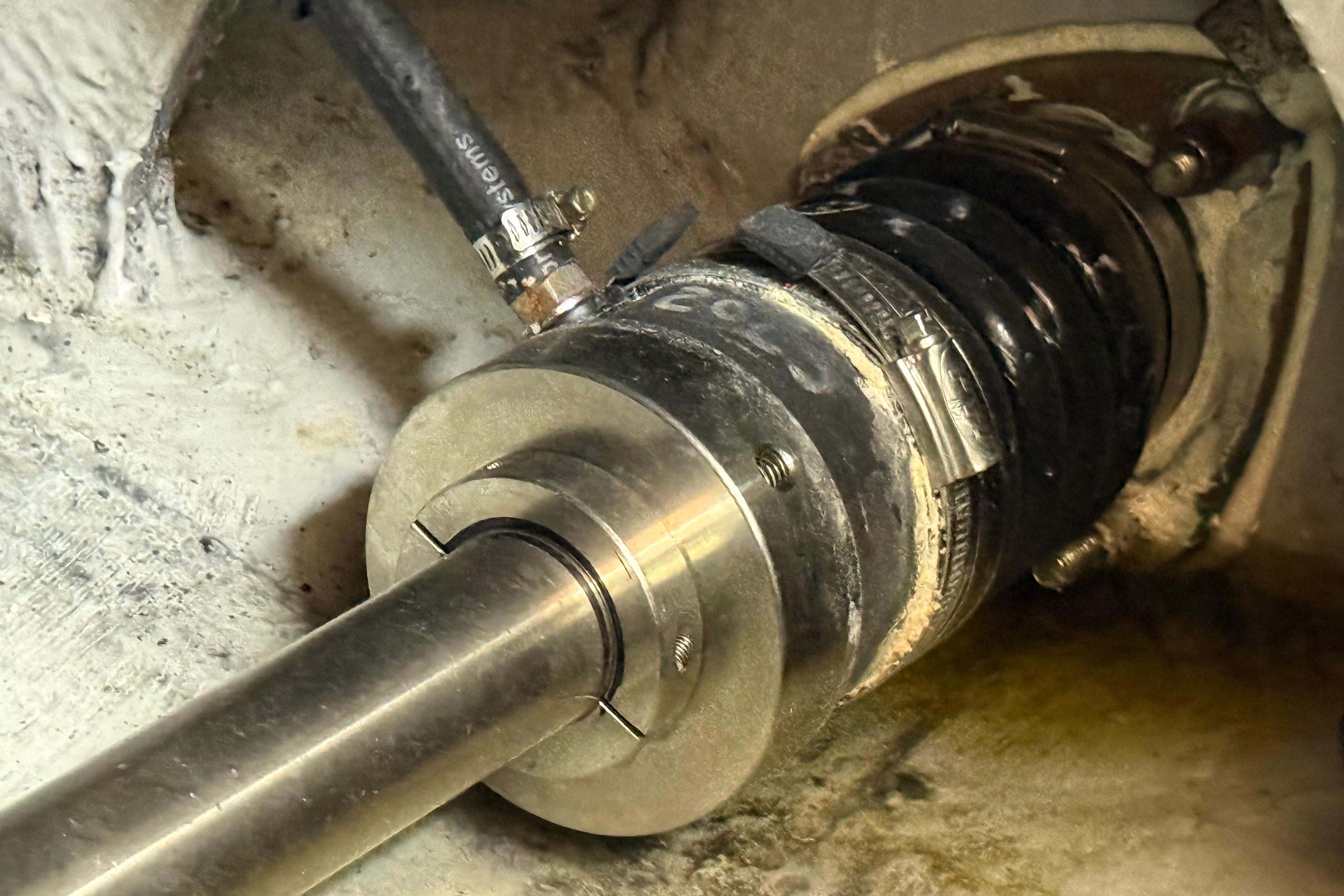Close-up of a 2003 Meridian 381 Sedan boat's propeller shaft and coupling system.