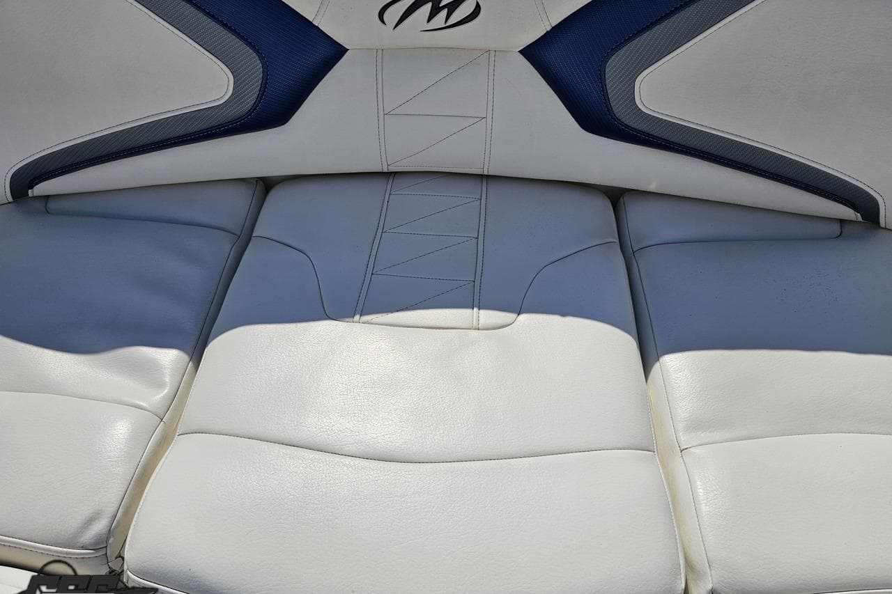 2013 Monterey M3 Sport Boat interior seating with white and blue upholstery.