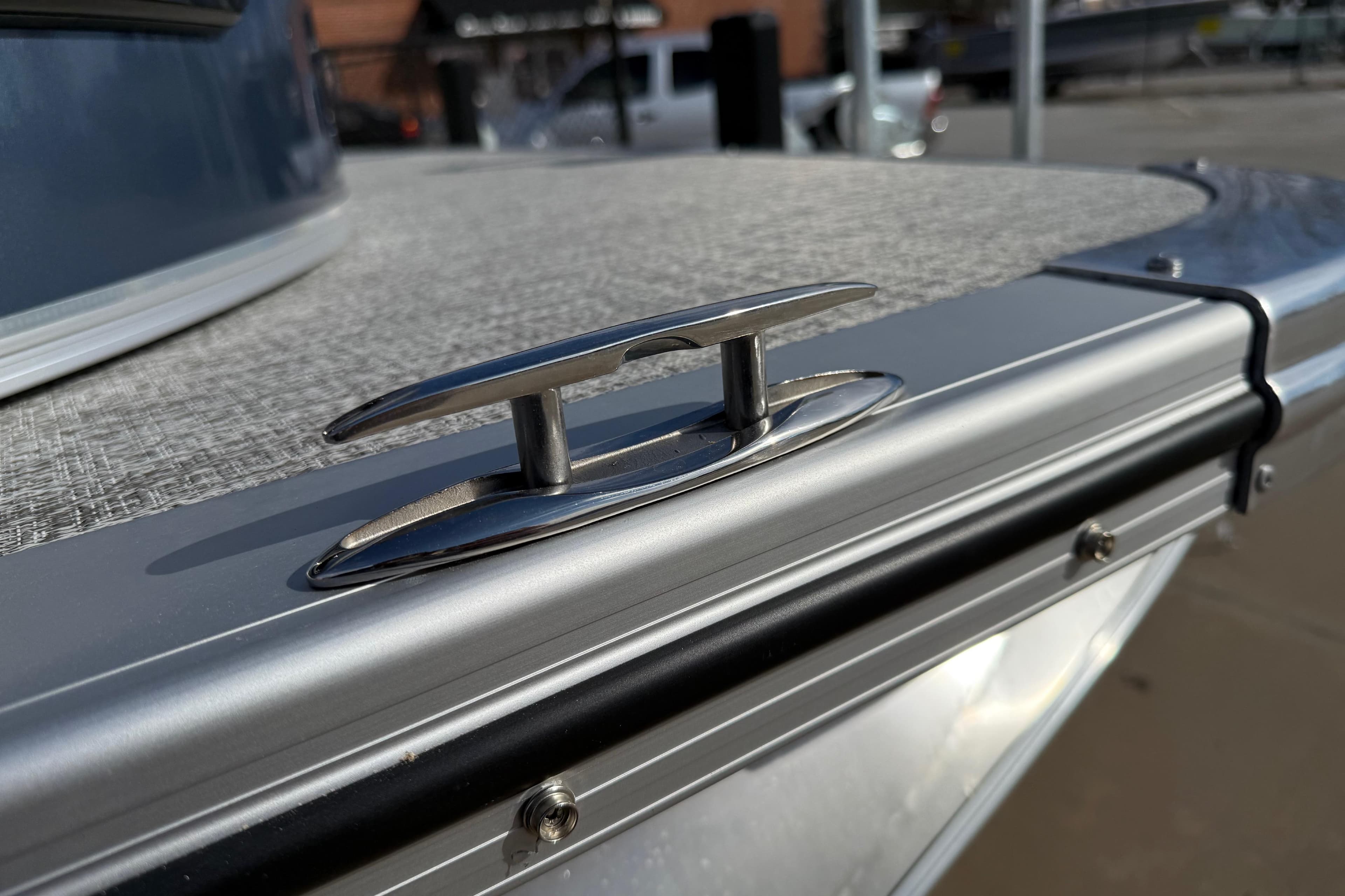2026 Avalon LSZ Versatile Rear Lounger boat cleat detail in sunlight.