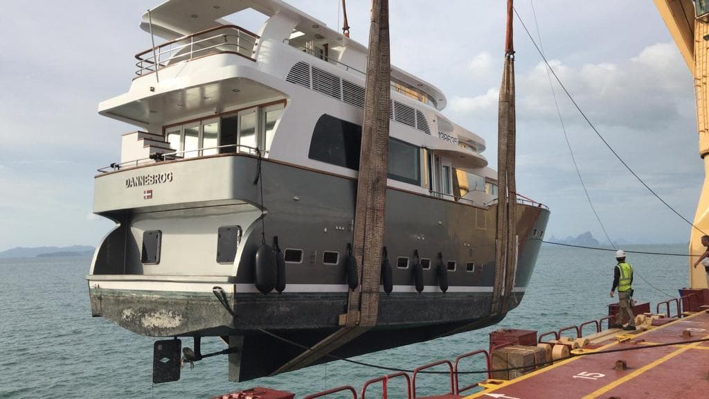 Luxury Bondway EX-11 yacht being lifted by crane, 2008 model, at a dockside location.