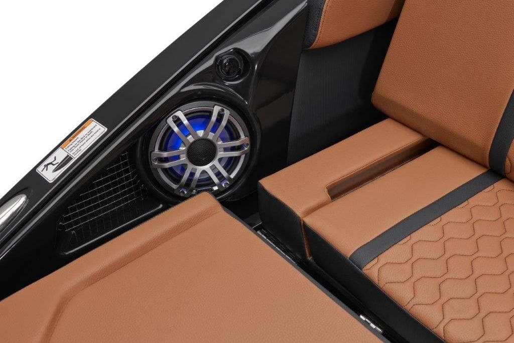 2026 Yamaha Boats 255XD interior with brown seating and built-in speaker system.