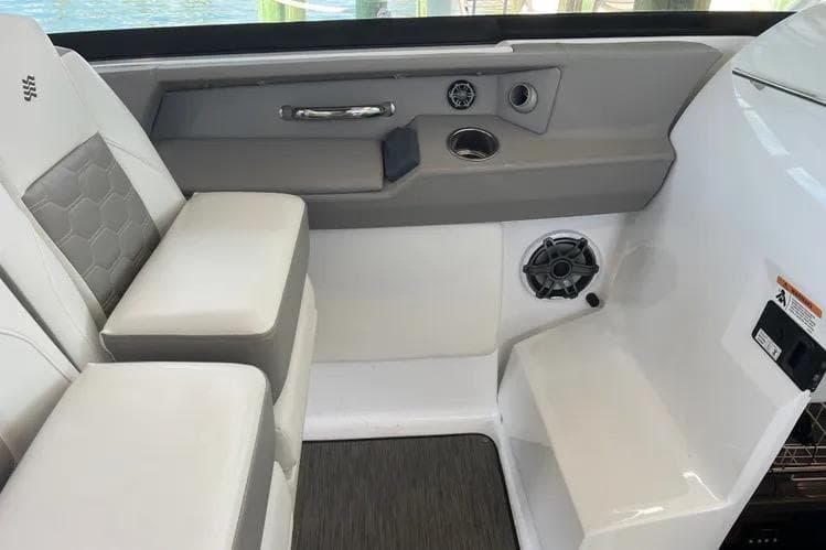 2023 Four Winns H350 OB boat interior with cushioned seating and modern design elements.