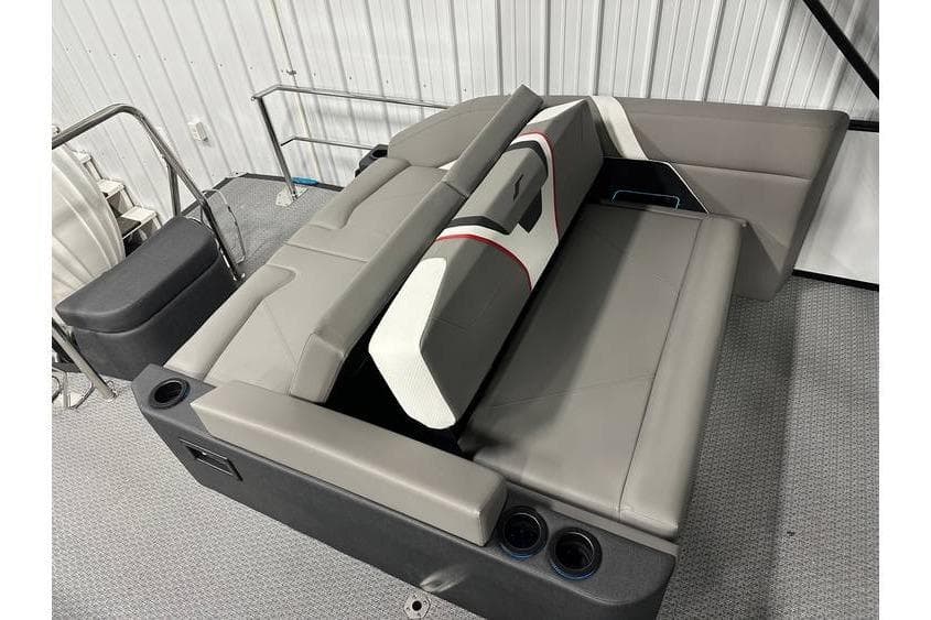 Gray seating area in a 2026 Evotti 723CS boat, featuring cup holders and modern design.
