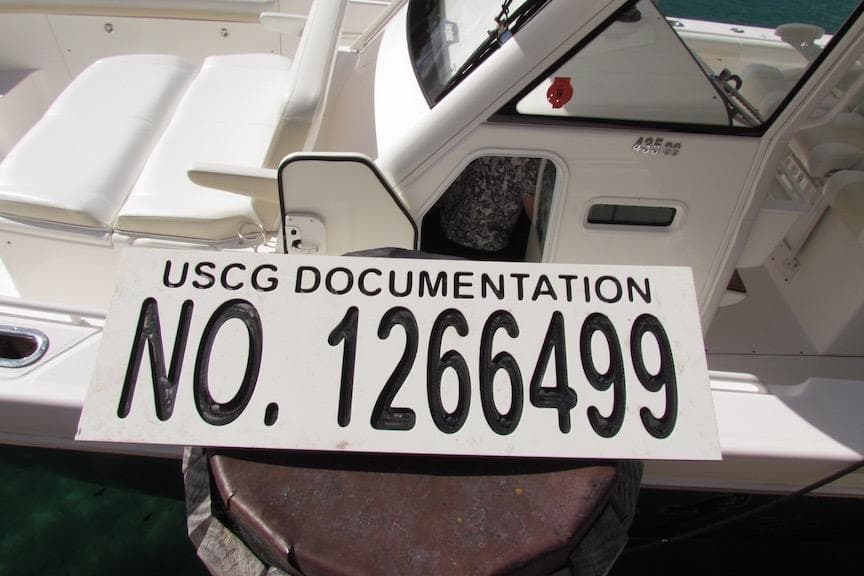 2016 Everglades 435 Center Console with USCG documentation number 1266499 displayed.