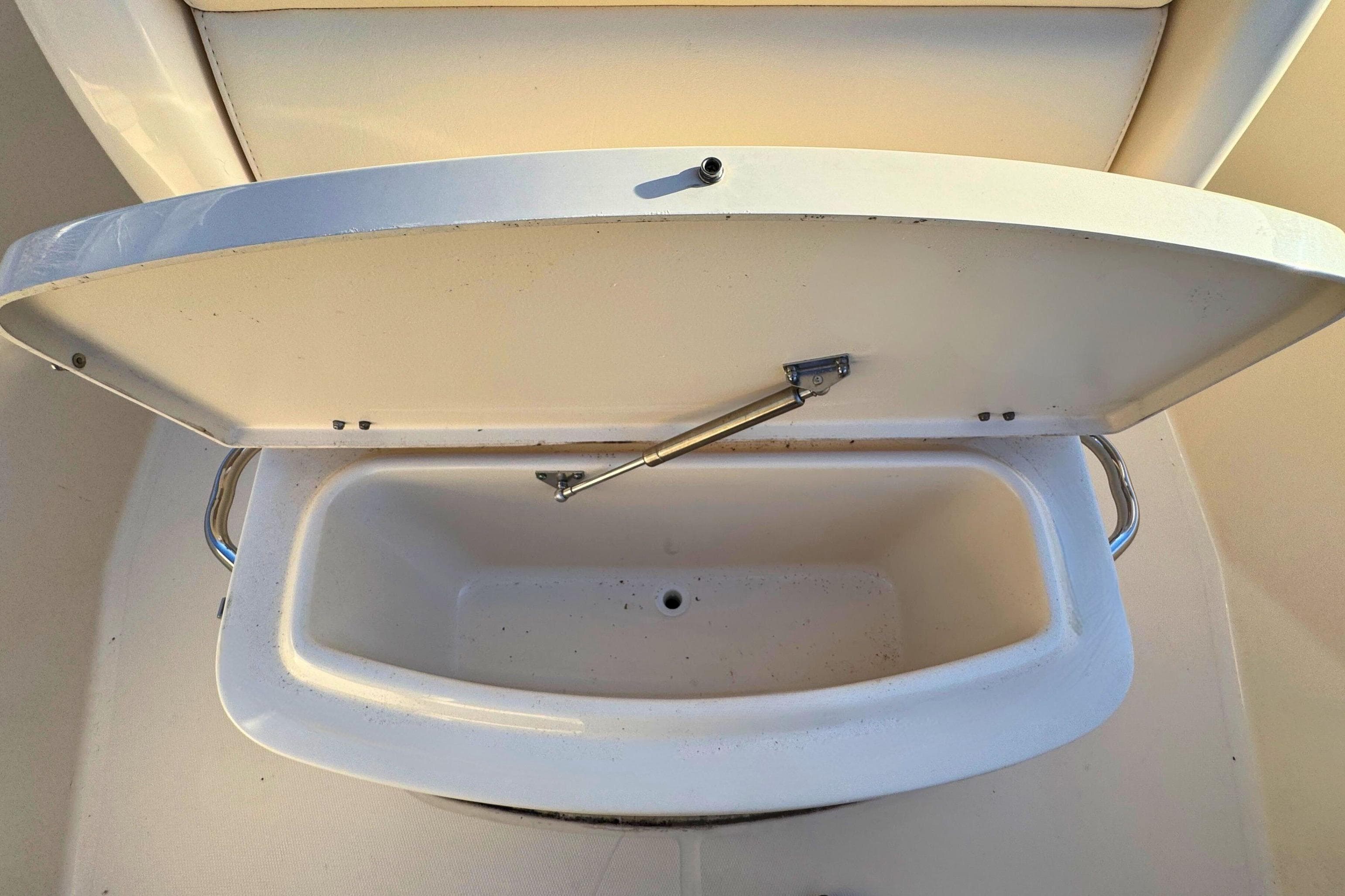 Open storage compartment on a 2018 Grady-White Fisherman 216 boat.
