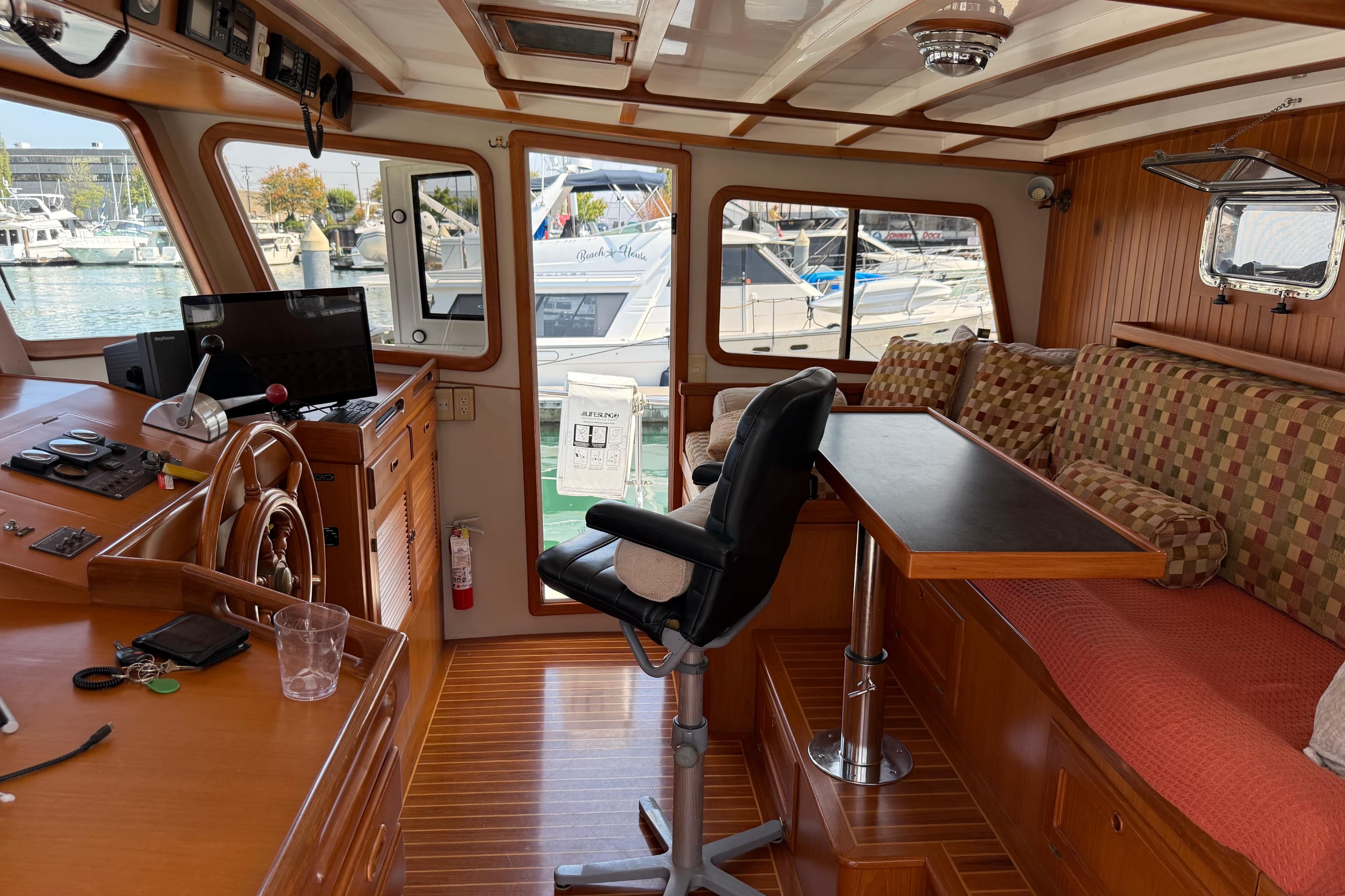 1998 Kadey-Krogen 48' Northsea Widebody Pilothouse interior with helm, seating, and table.