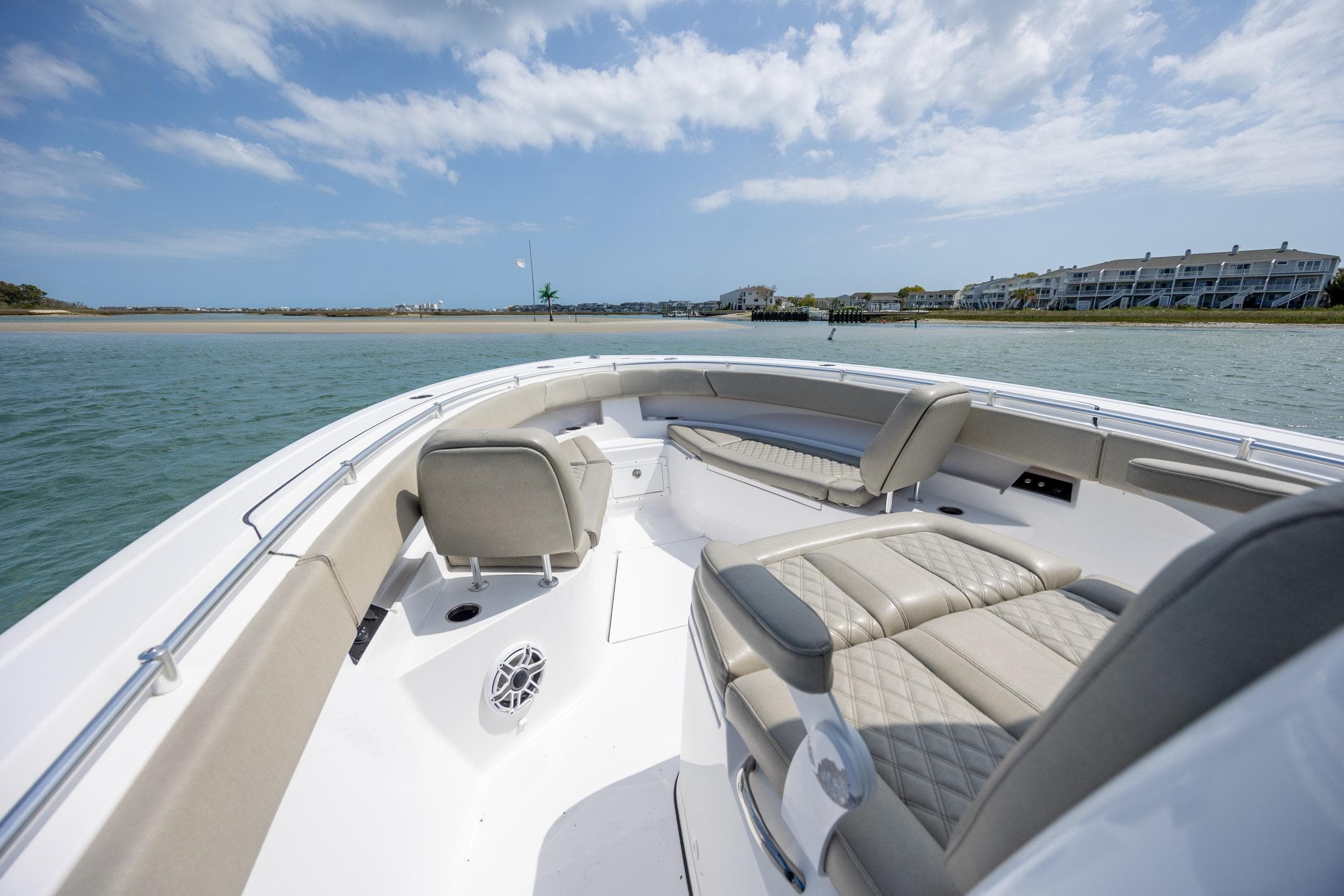 2021 Sportsman Open 322 Center Console boat interior with luxurious seating on calm water.