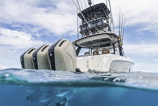 Manufacturer Provided Image: 2025 Boston Whaler 420 Outrage with multiple outboard engines on the ocean.