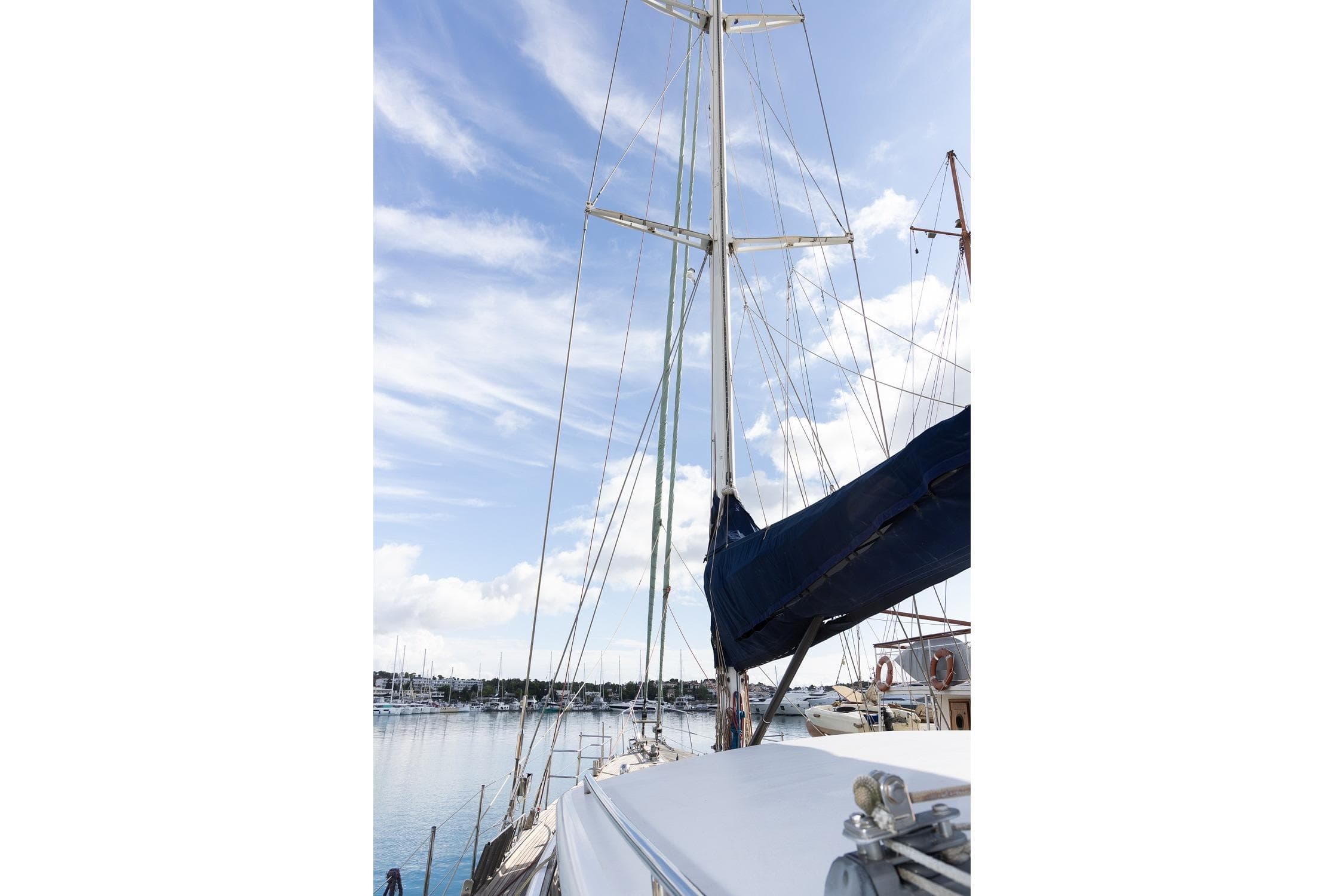 Sailing yacht Jongert 30M, 1996 model, docked with clear blue sky.