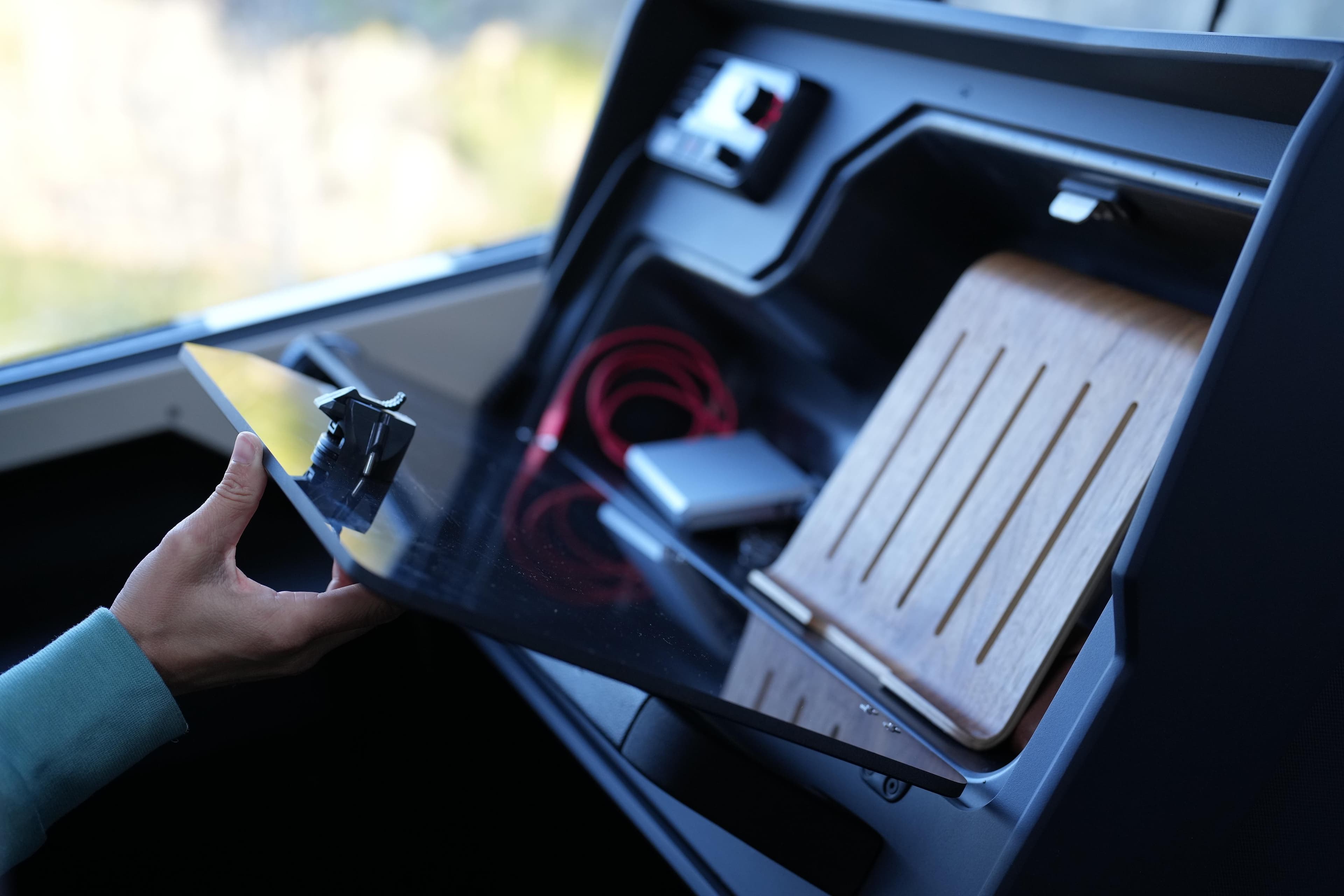 Interior of 2026 Jaktar J30 Black Vision with storage compartment and accessories.