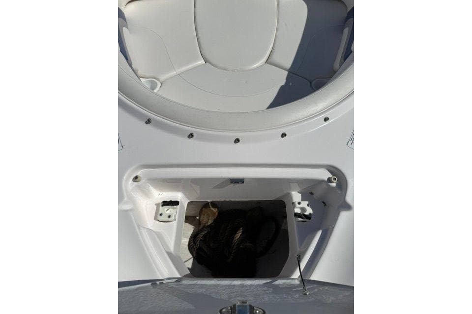 2004 Yamaha Boats SX230 storage compartment with seating area.