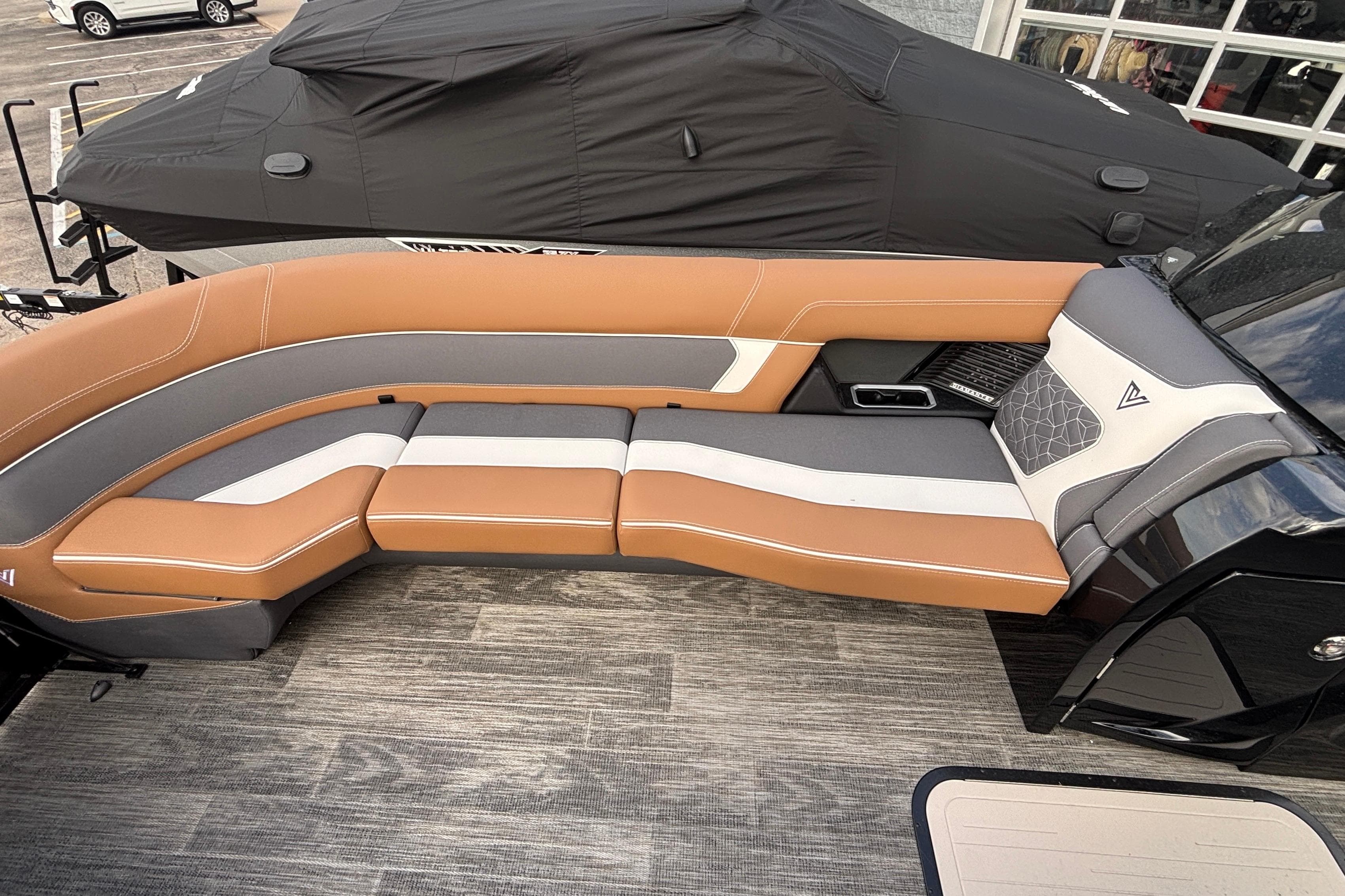 Luxurious seating on 2026 Viaggio Diamante U 26 boat, featuring tan and gray upholstery.