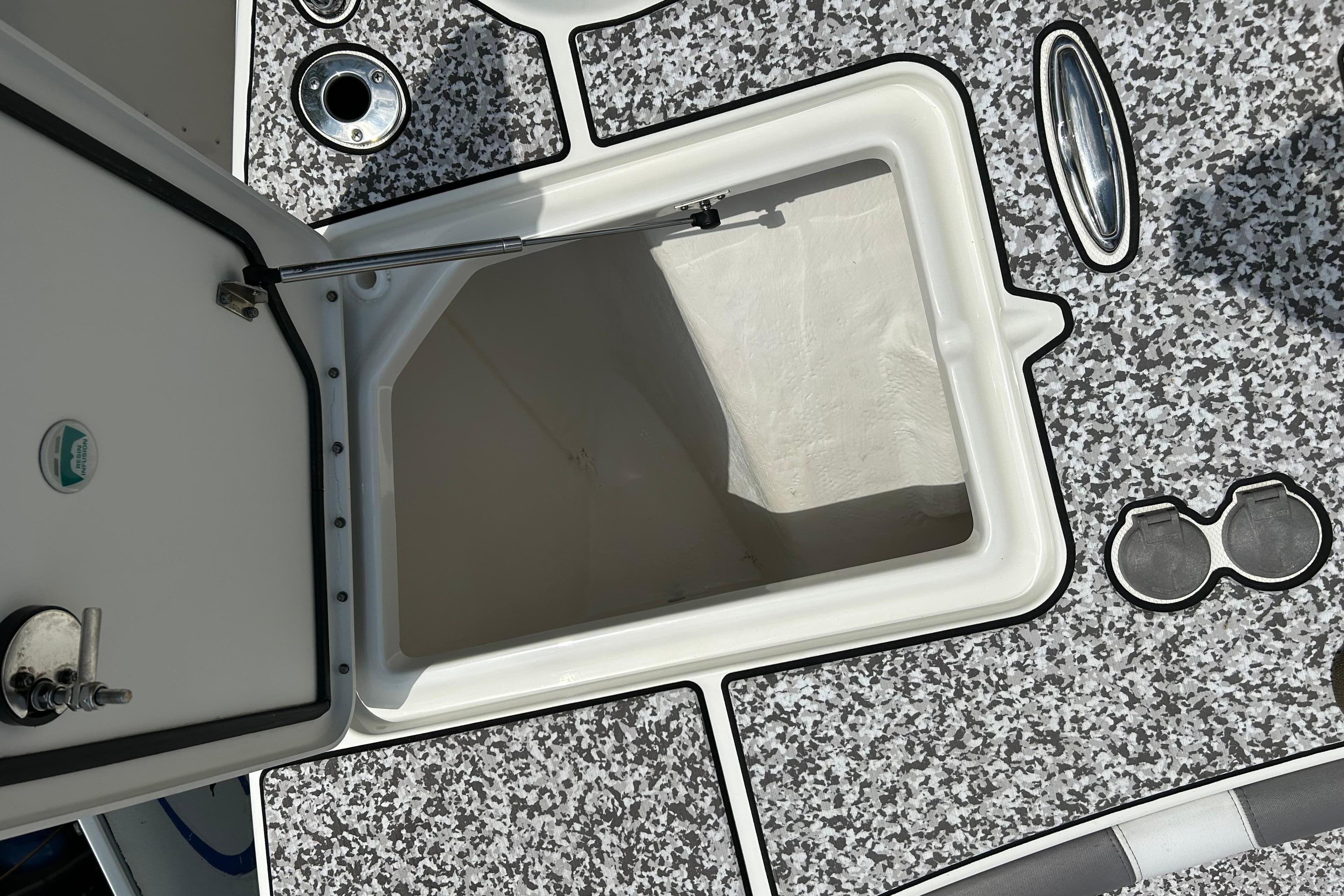 Open storage compartment on 2018 World Cat 320 CC boat deck.