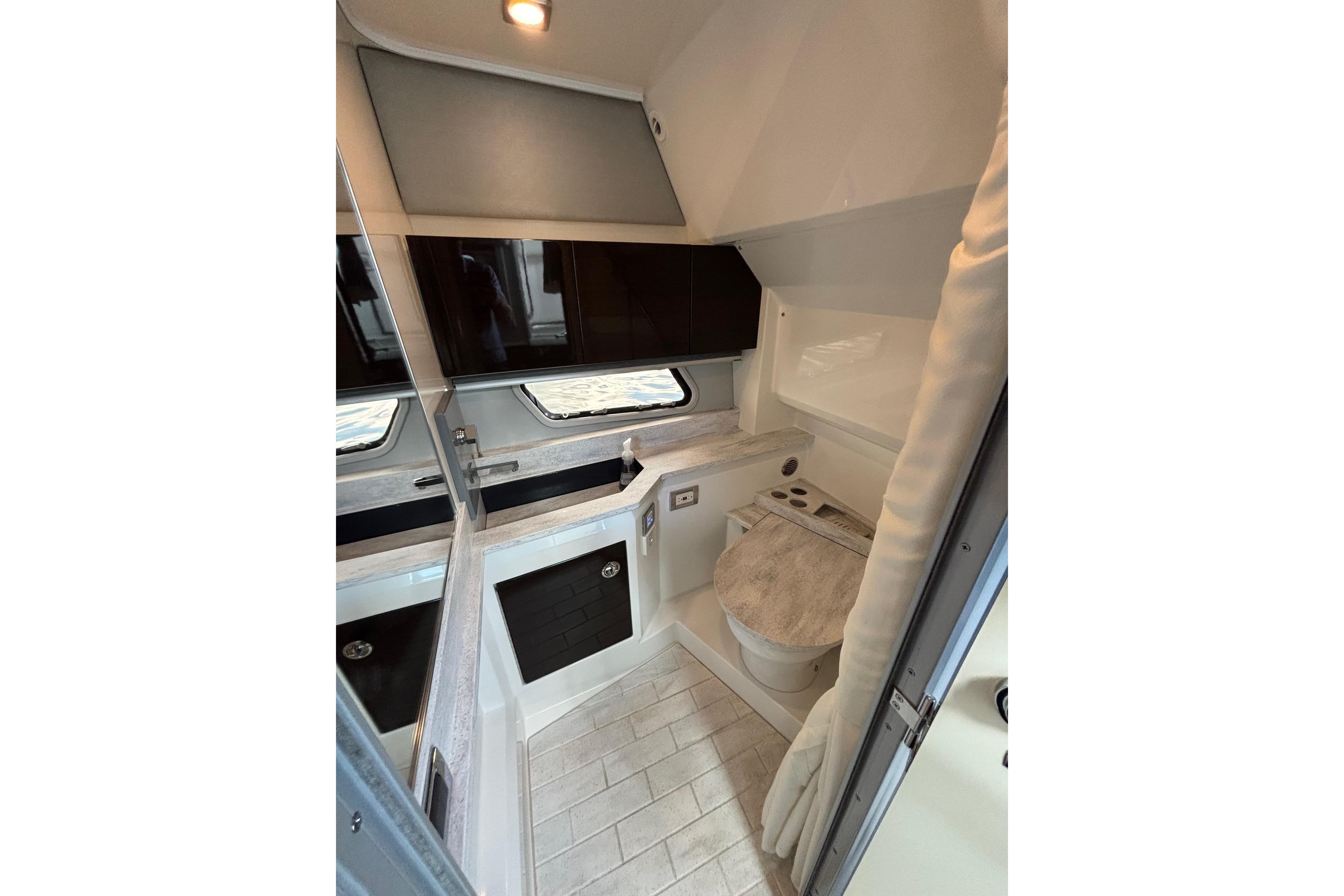 2017 Formula 430 Super Sport Crossover bathroom interior with modern fixtures and sleek design.