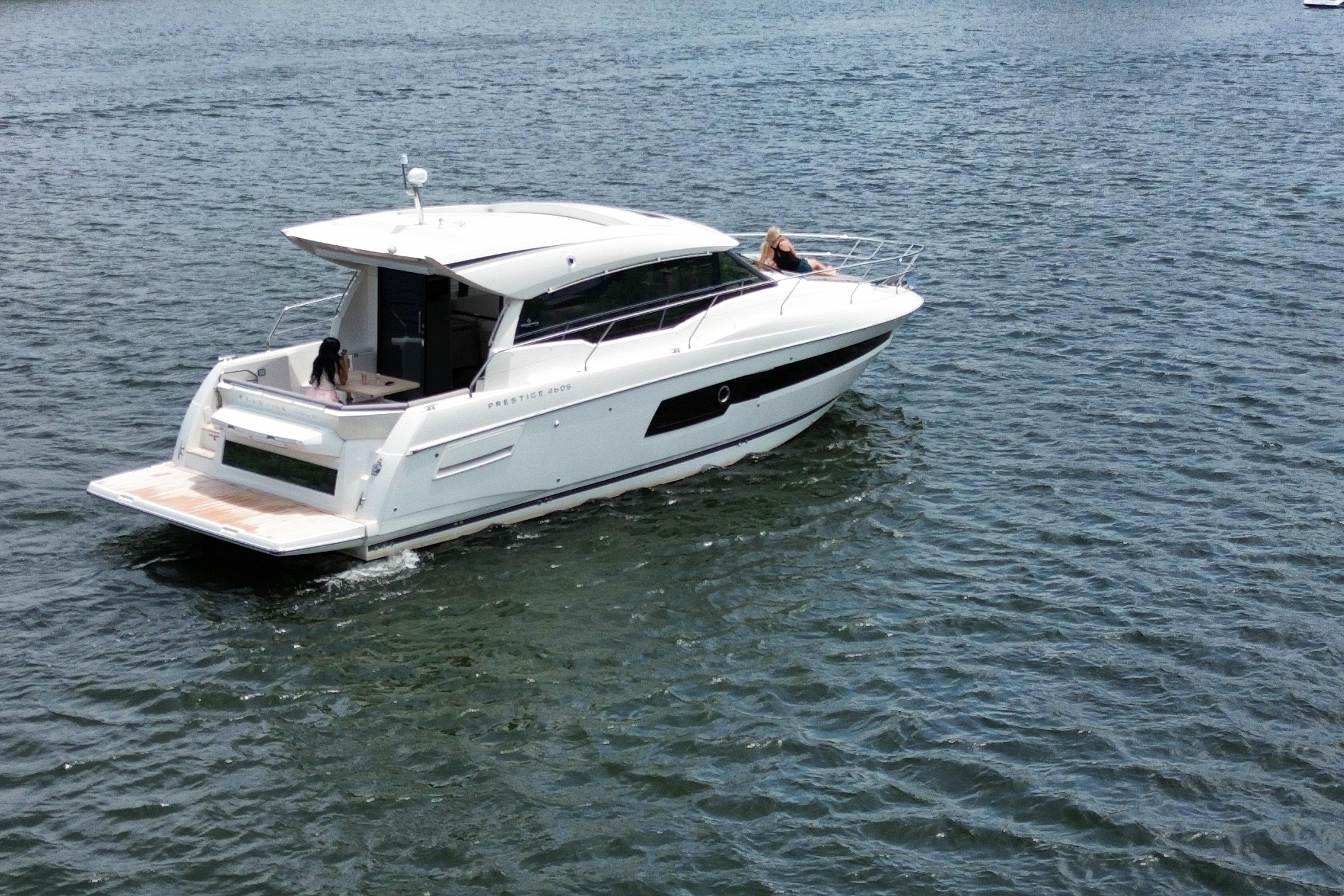 2025 Prestige 460S yacht cruising on open water, showcasing sleek design and luxury features.