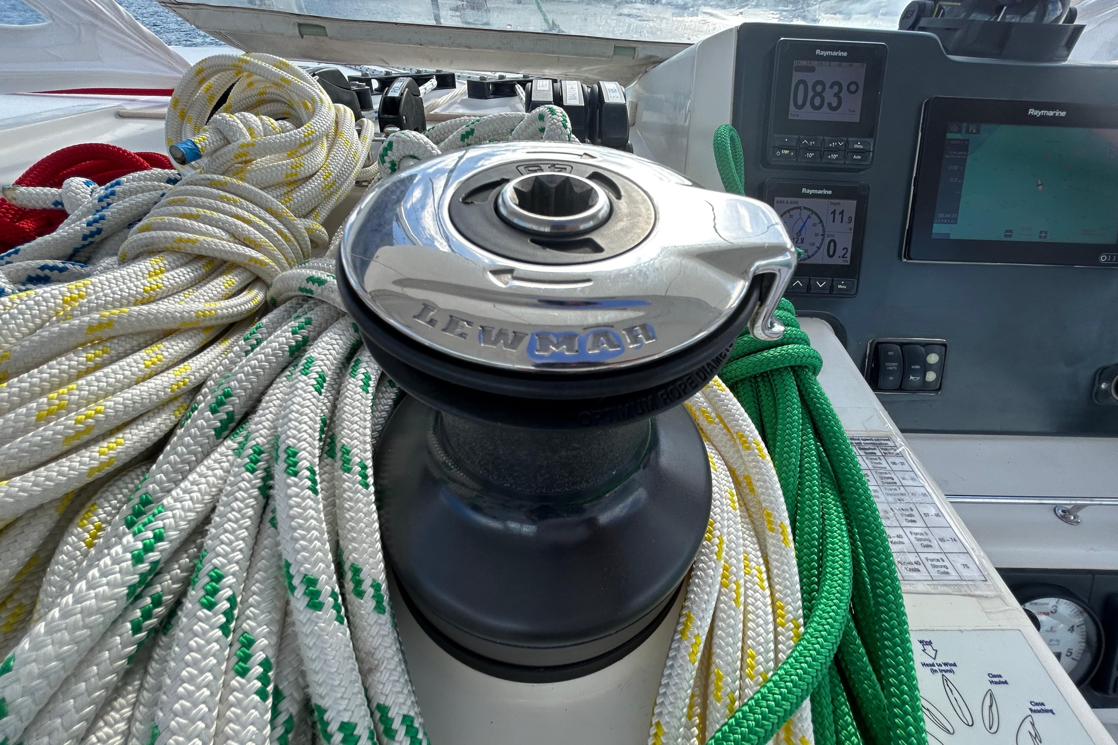 Winch with colorful ropes on a 2020 Leopard 45 yacht, featuring navigation instruments.