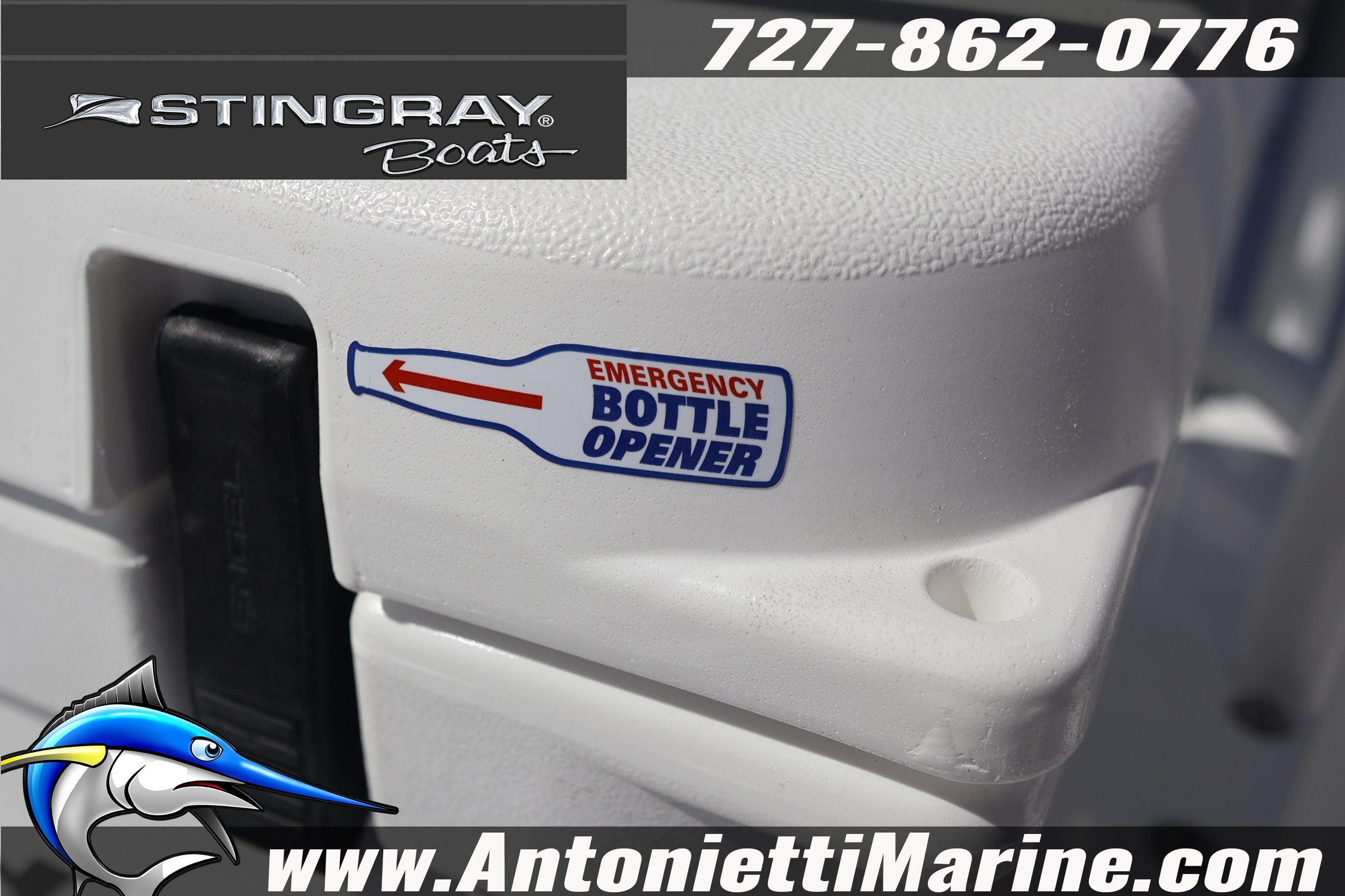 2026 Stingray 216 CC boat detail with emergency bottle opener sticker, Antonietti Marine branding.