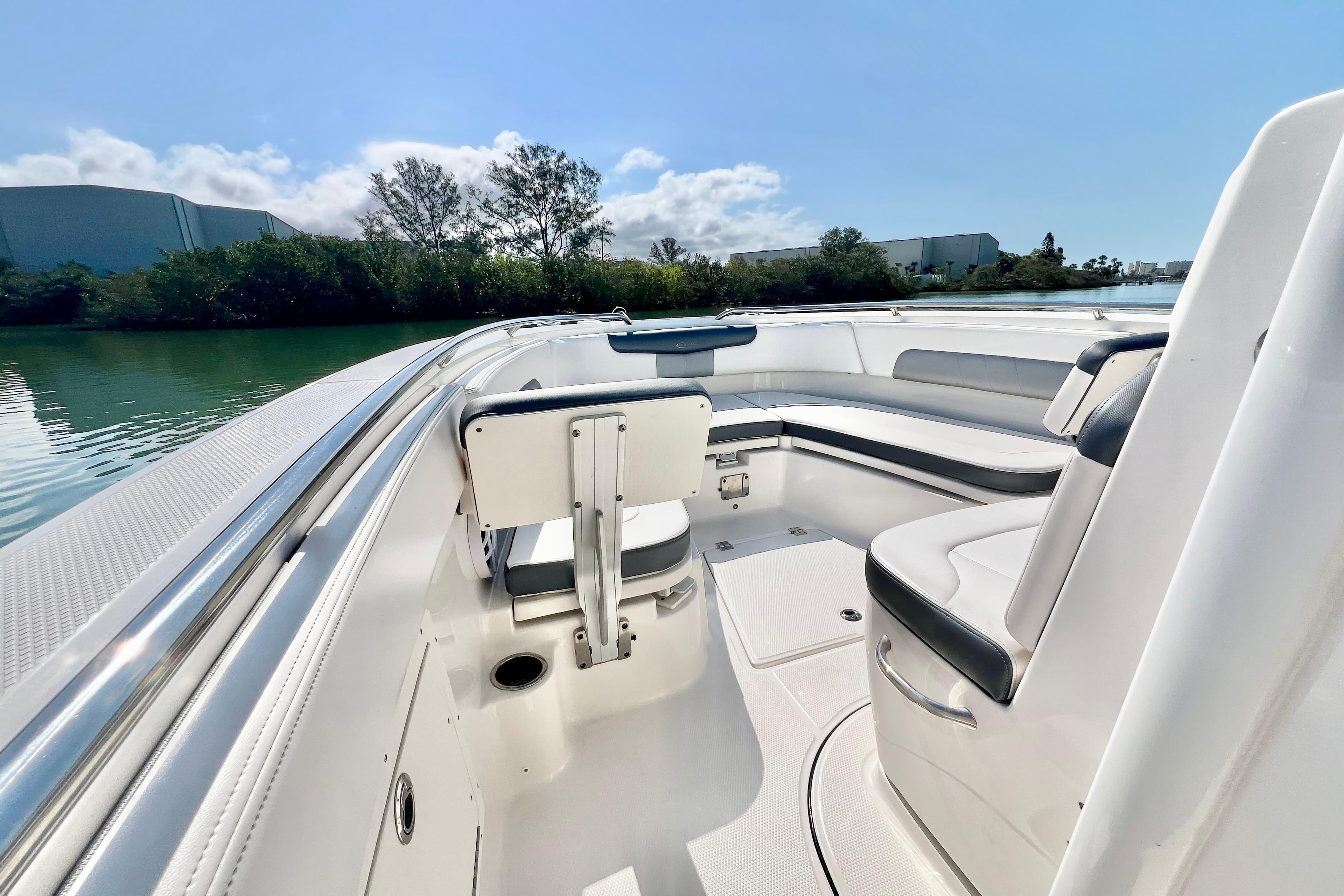 2021 Robalo R242 Explorer boat interior with sleek seating and scenic water view.