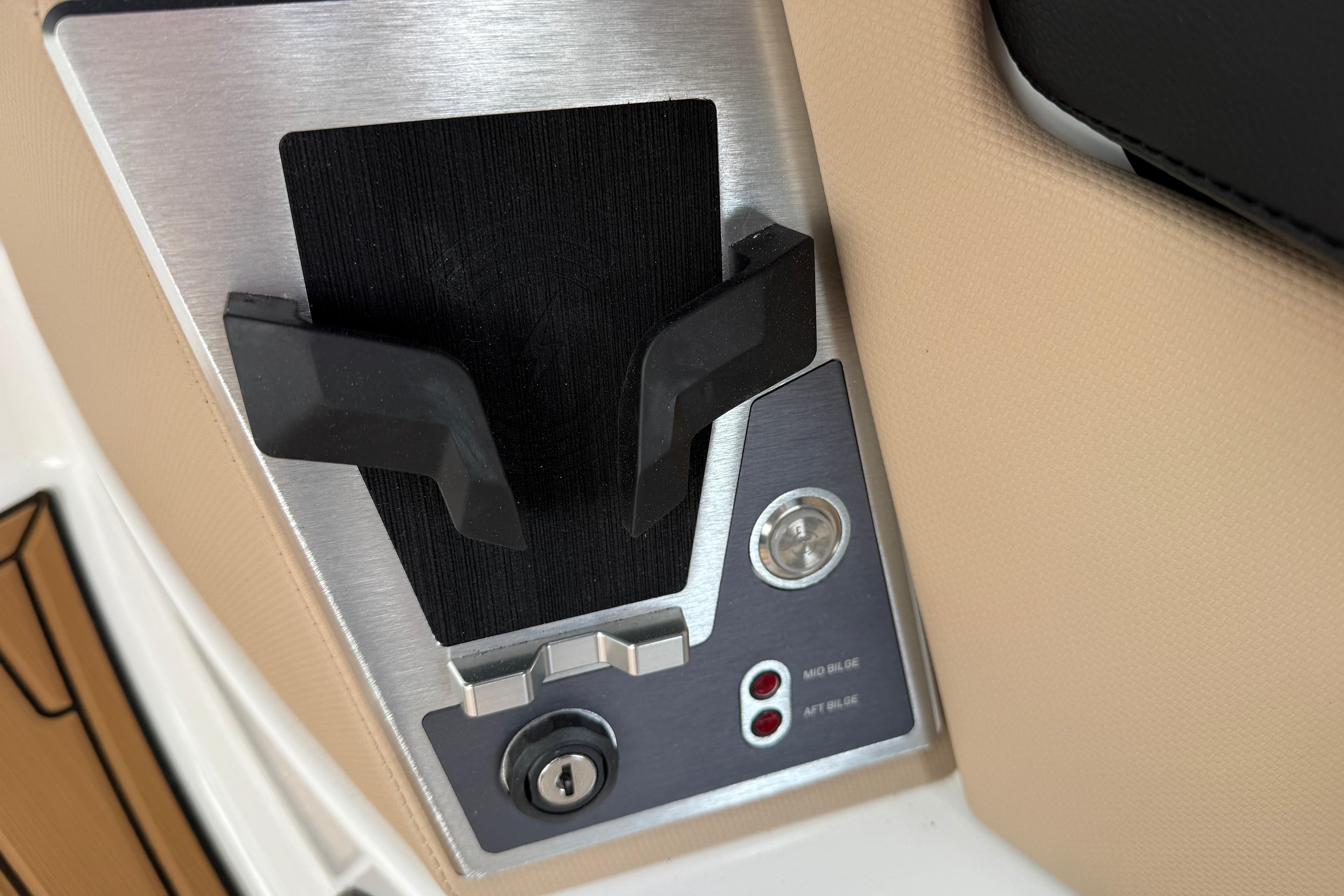 Control panel of 2025 MasterCraft X24 boat with key slot and switches.